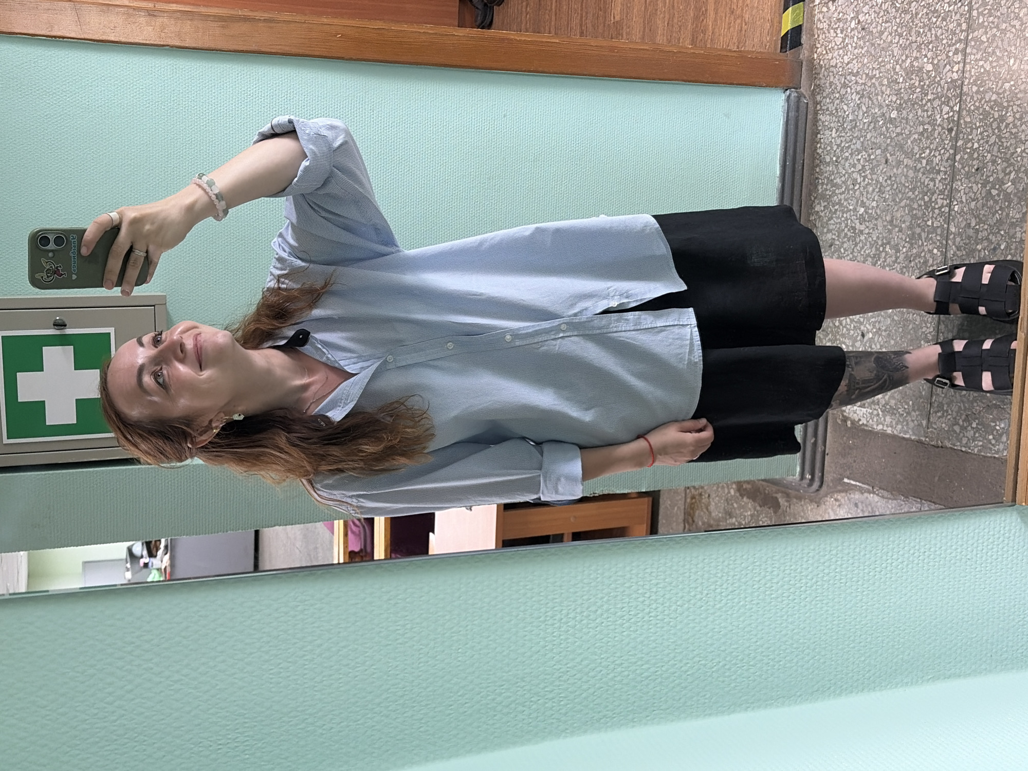 Mirror selfie in an office hallway, Chaikovsky, Russia
