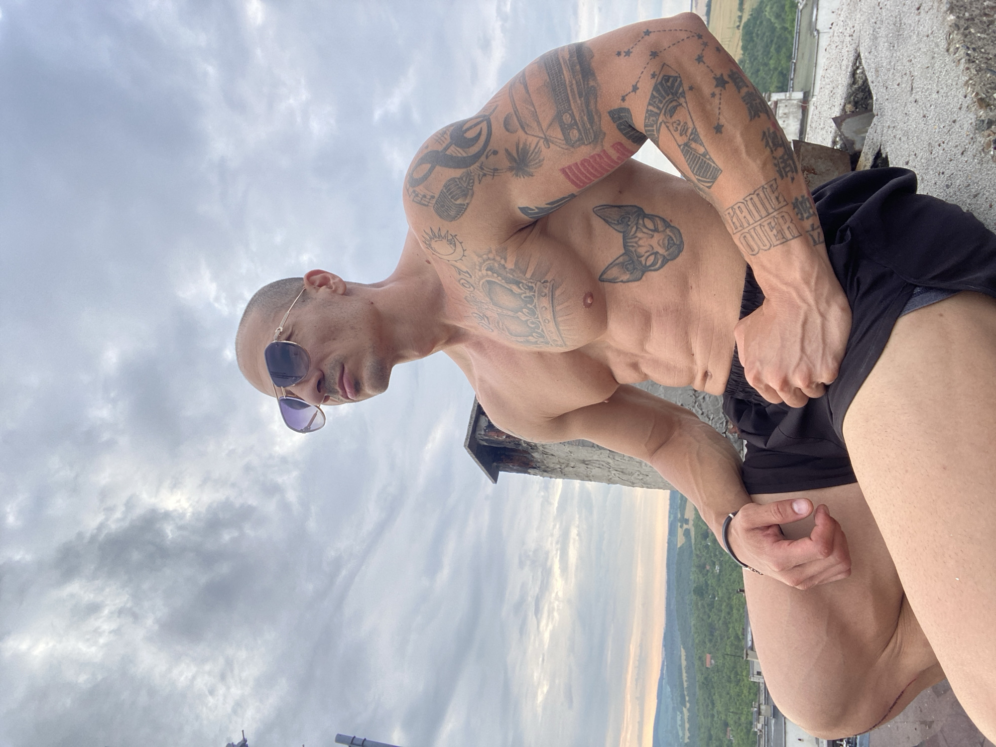 Rooftop session in Pleven with tattoos and cloudy skies