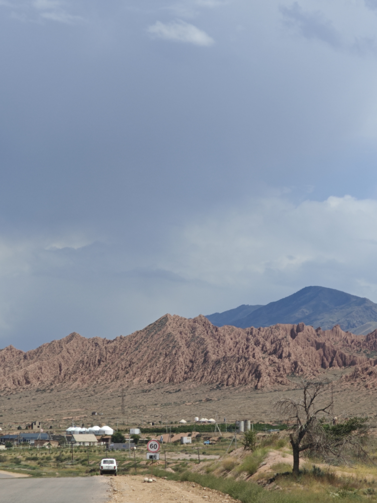 Kaji-Say roadside stop amid Kyrgyzstan's steppe and mountain scenery