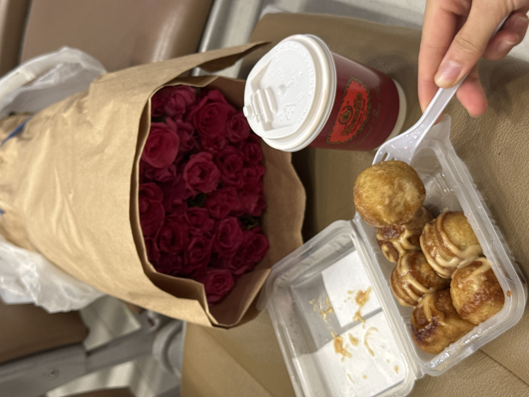 Roses on a cafe table, toddler on the tiles nearby