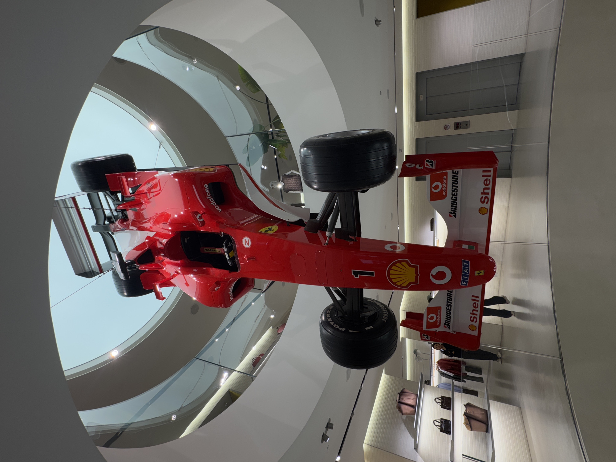 Ferrari F1 car suspended in Milan building display