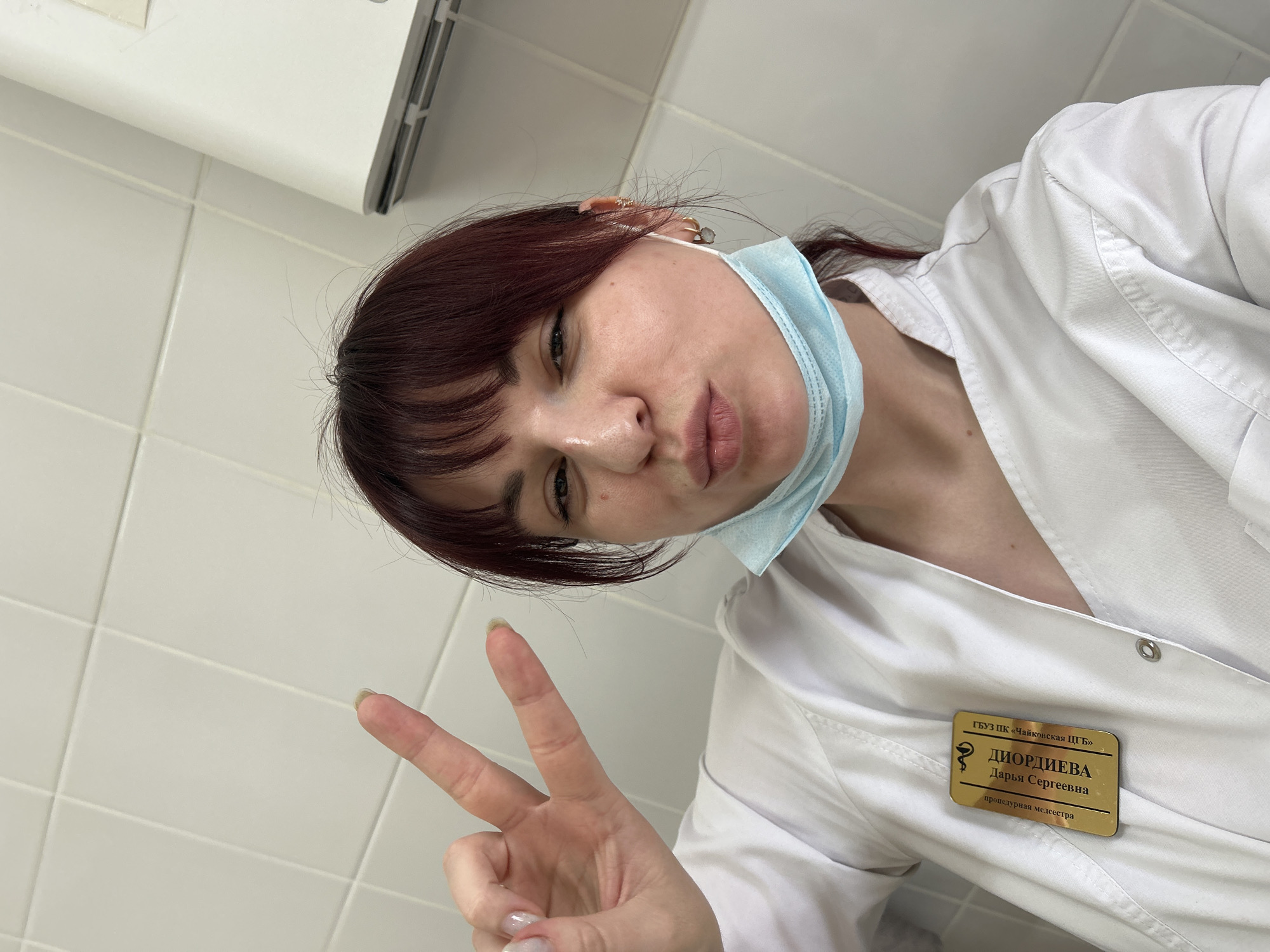 Healthcare worker takes selfies during break at Russian medical facility