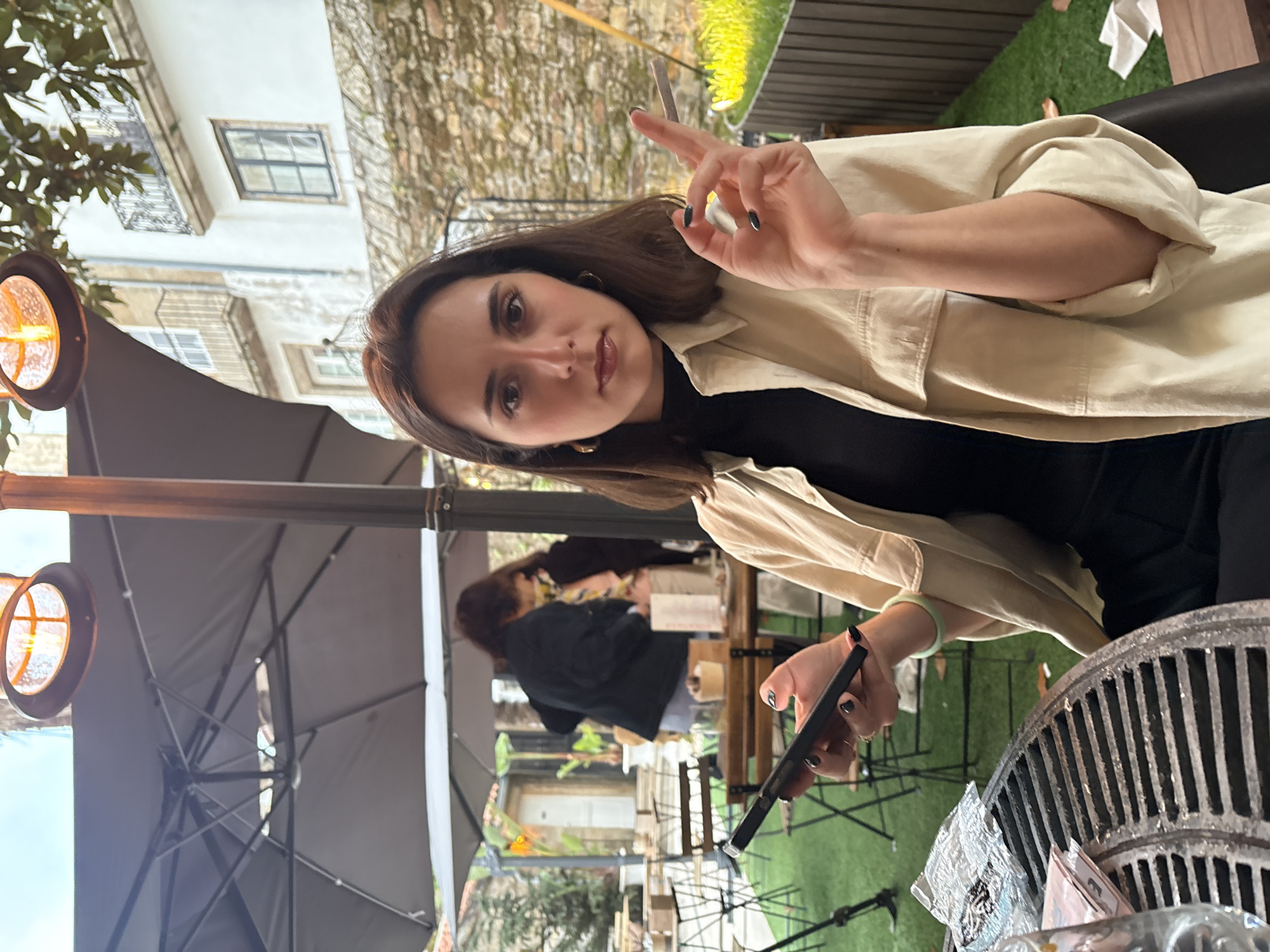 Woman dines at outdoor cafe in Santiago De Compostela