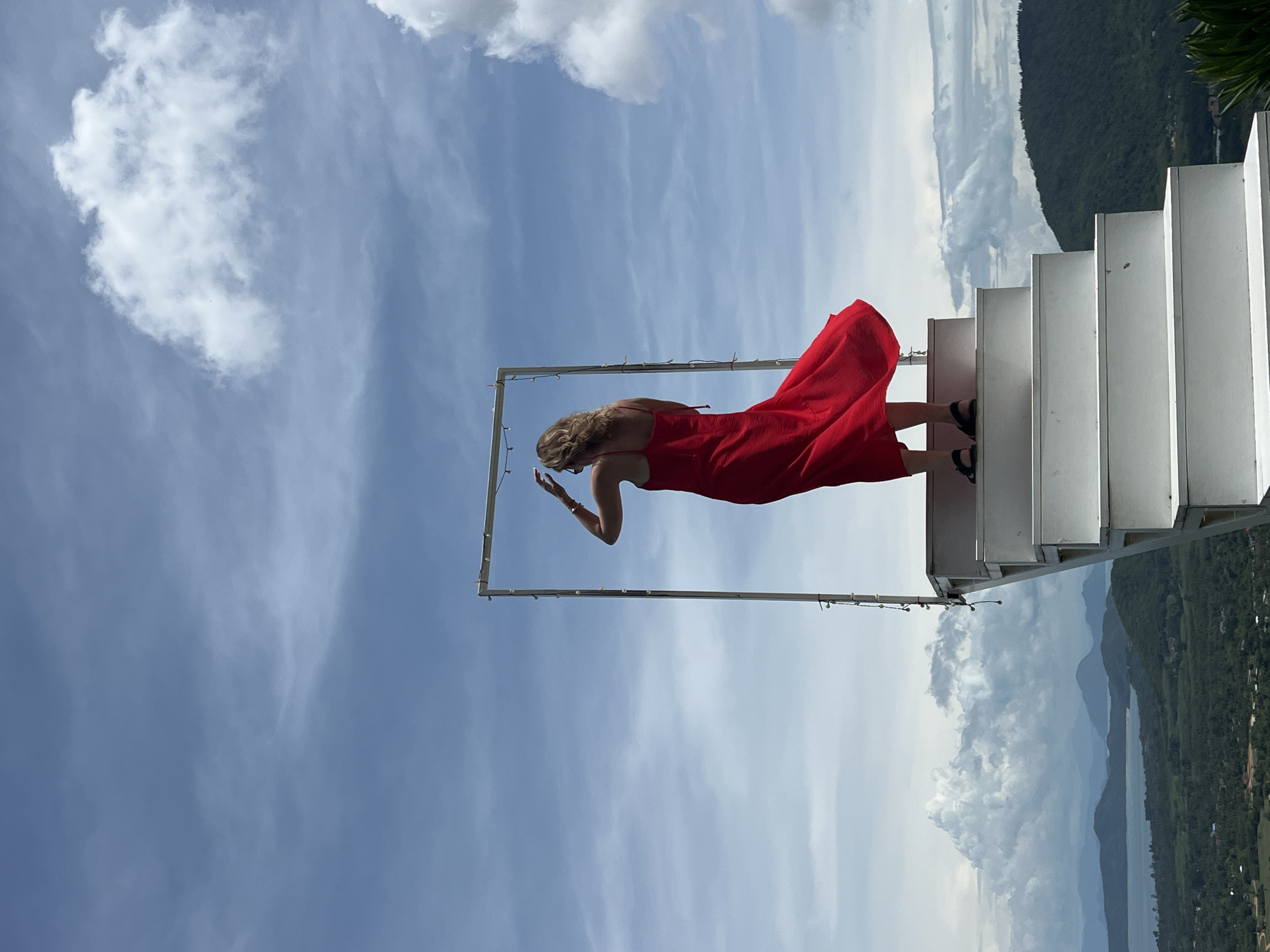 Visitors pose at hillside staircase art installation in Thailand
