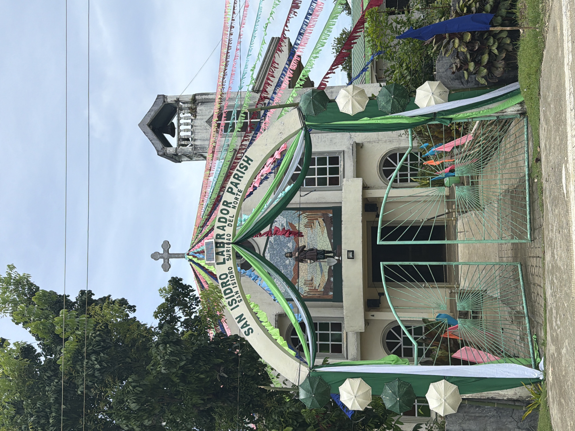 Philippines church decorated with colorful buntings and umbrellas