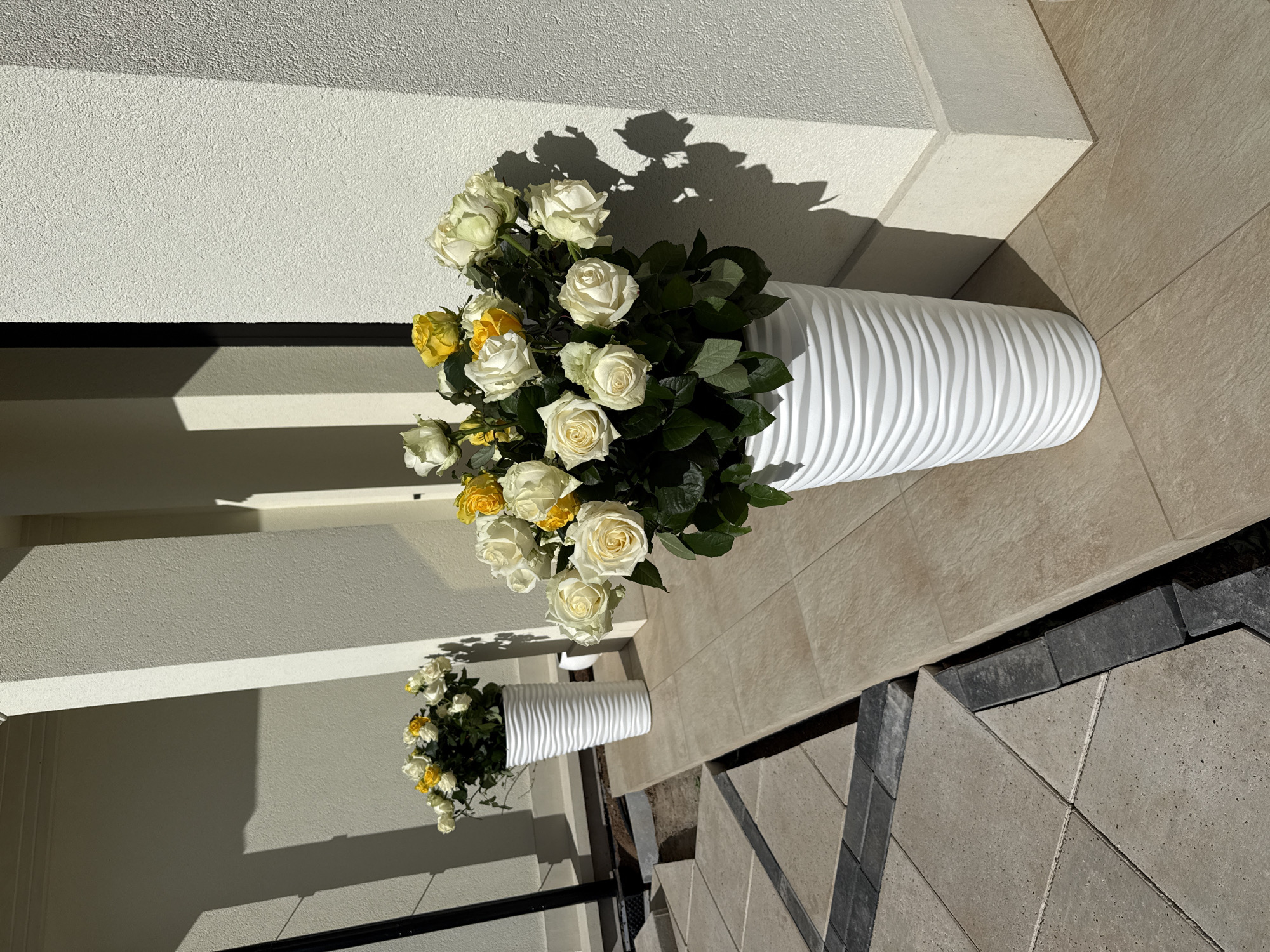 Outdoor market display with flowers, preserves, champagne in Гольяны