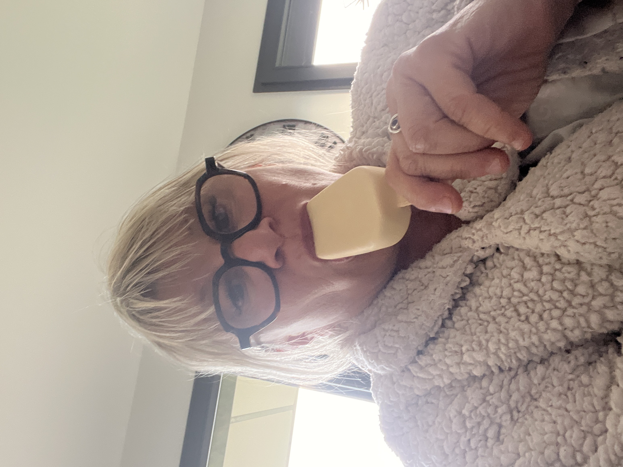 Person holds soap bar to face in Chambœuf