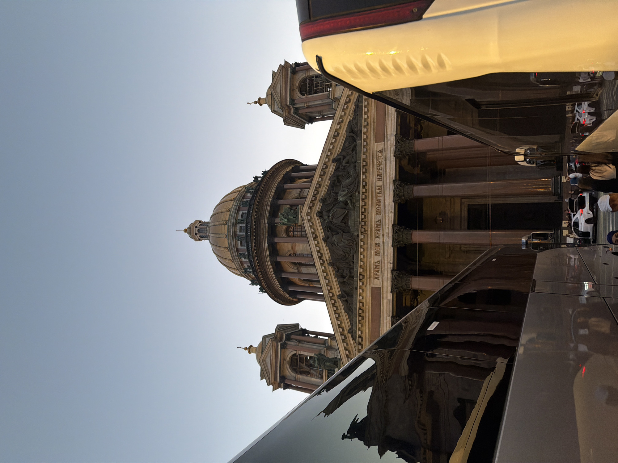 Evening foot traffic around a grand domed landmark