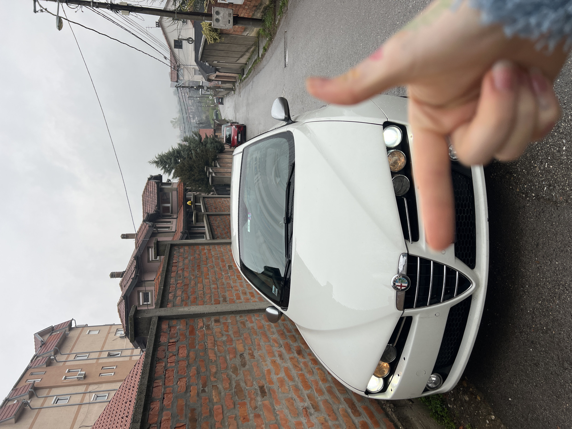 White Alfa Romeo spotted on narrow Belgrade street