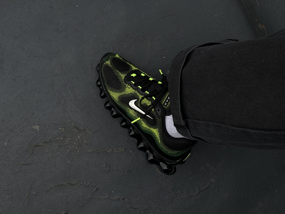 Person in neon sneakers spotted on wet London pavement