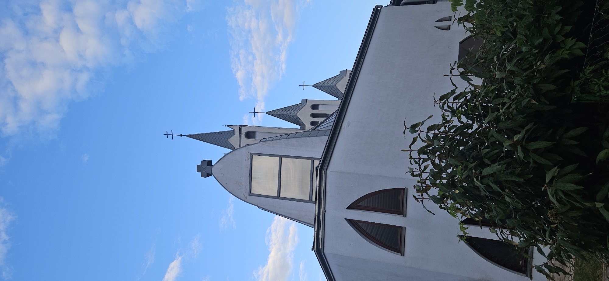 Churches, pine trees, and street details in Hévíz, Hungary