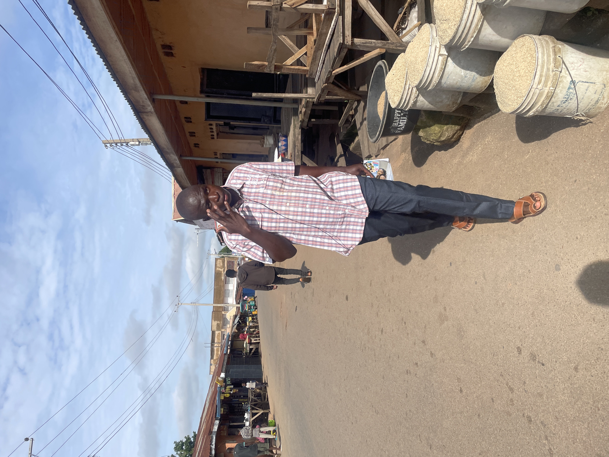Everyday street scenes near a Jos market, Nigeria.