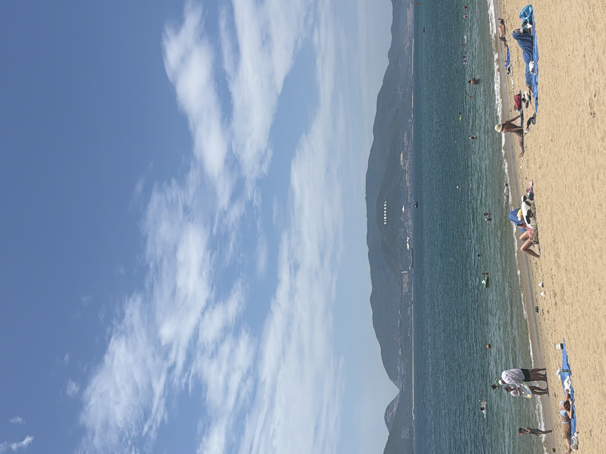 Nha Trang beach in full swing — sun, surf, and kites