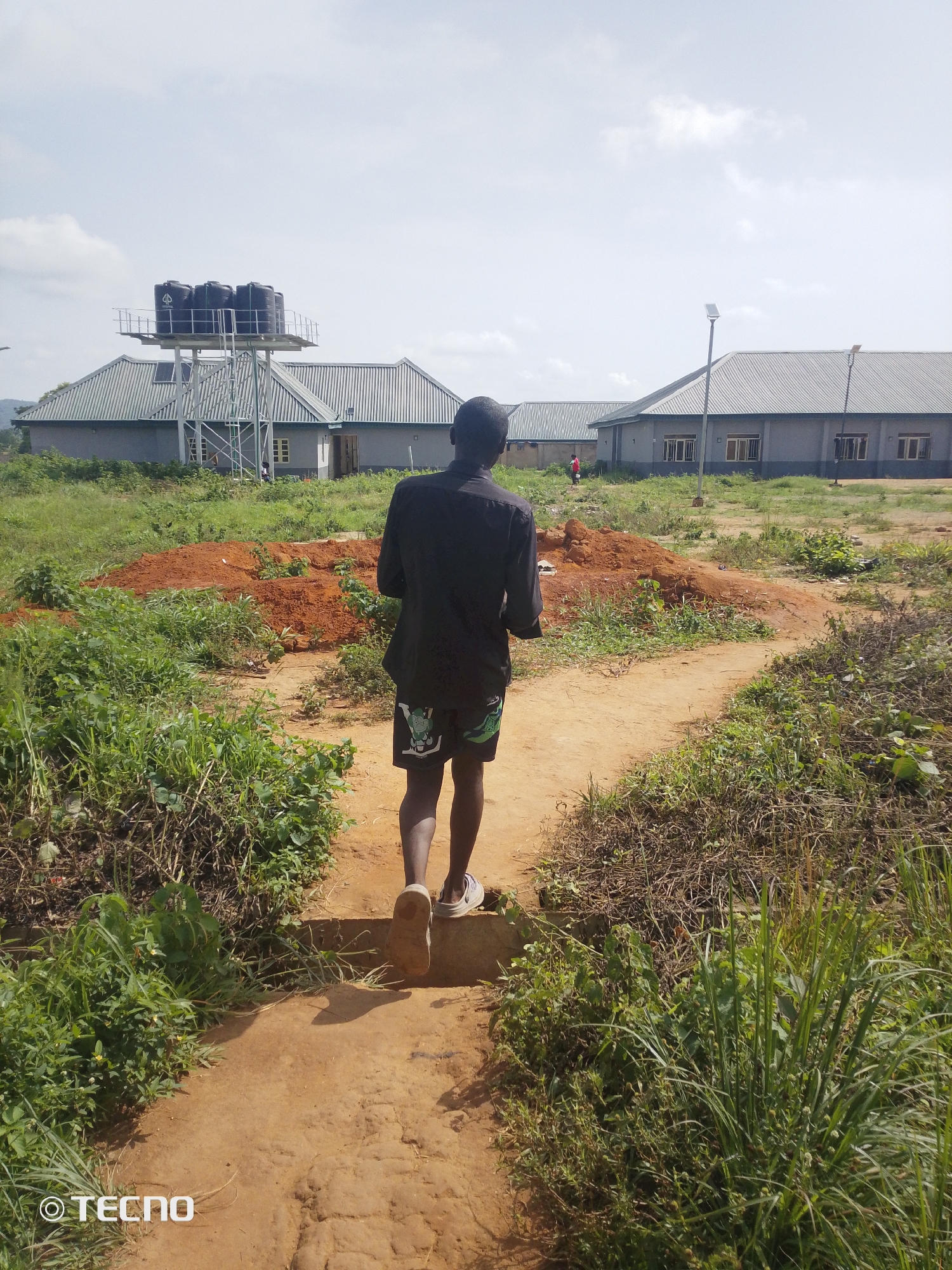 Morning routine inside and around a building in Gumel, Nigeria