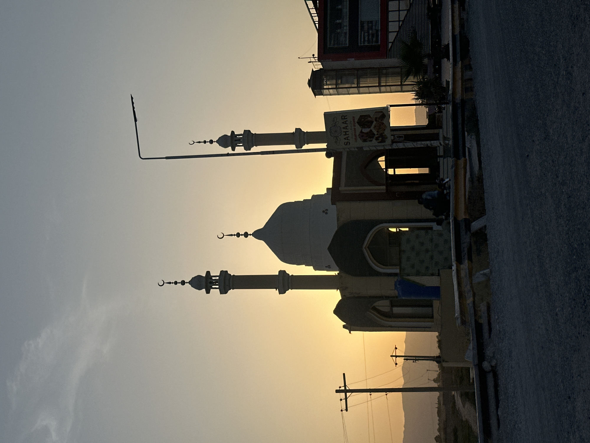 Mosque silhouette at golden hour, Quetta