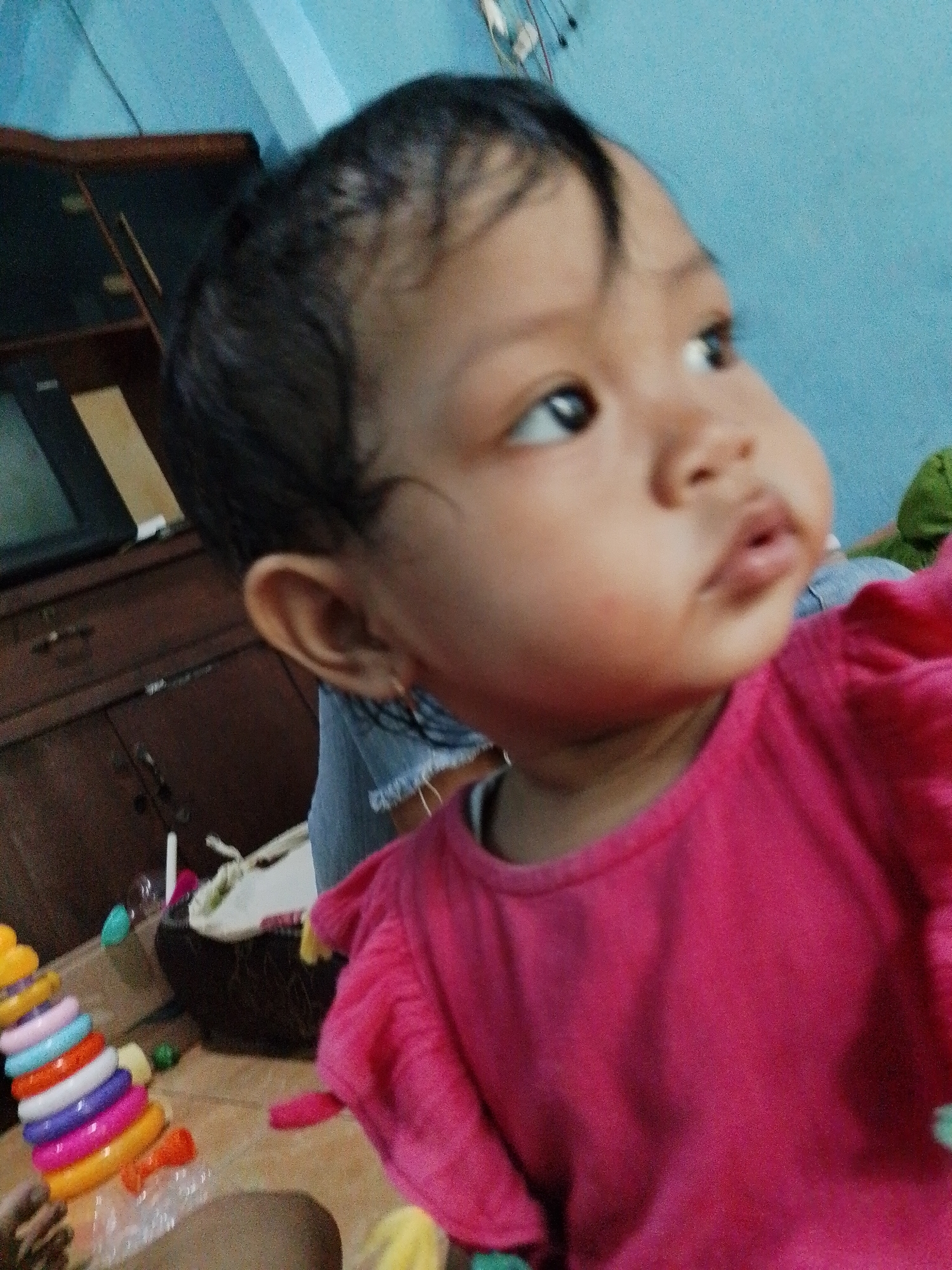 Baby in pink top observed at home in Pati
