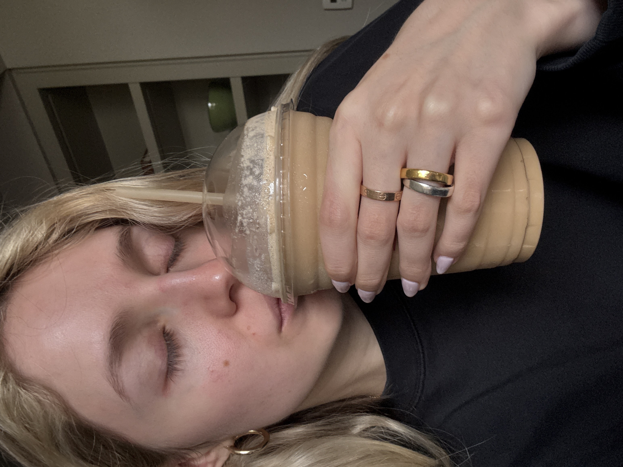 Woman relaxes with coffee drink in Mexico City home