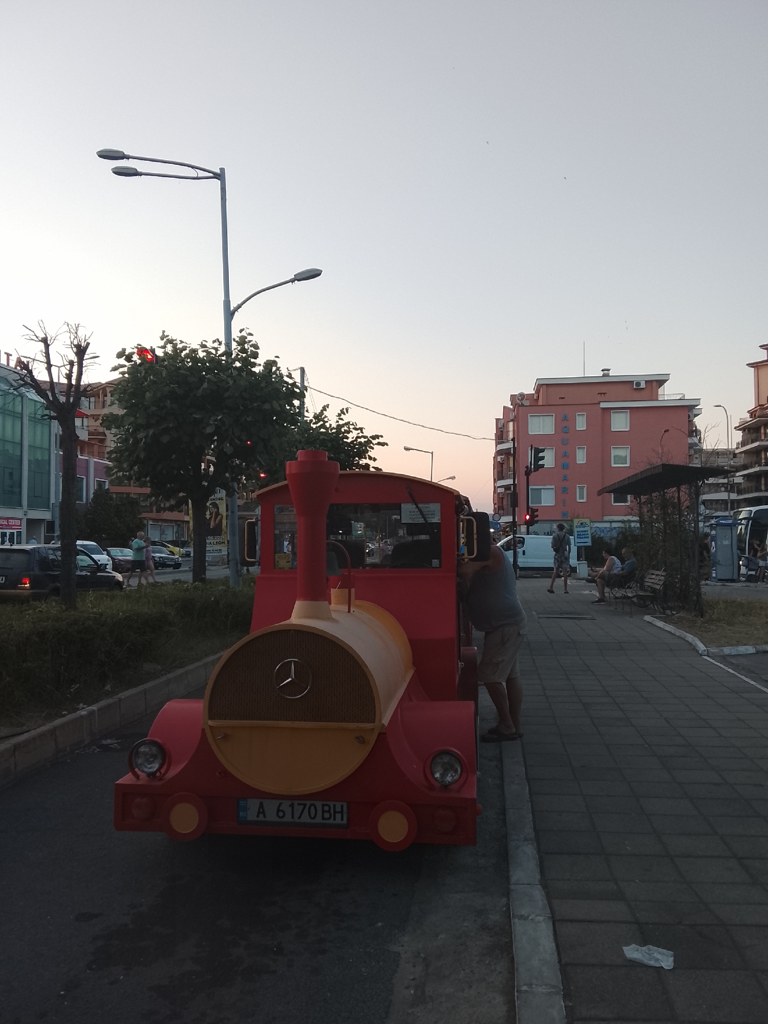 Tourist train and seaside hotels along Nesebar's coastal strip
