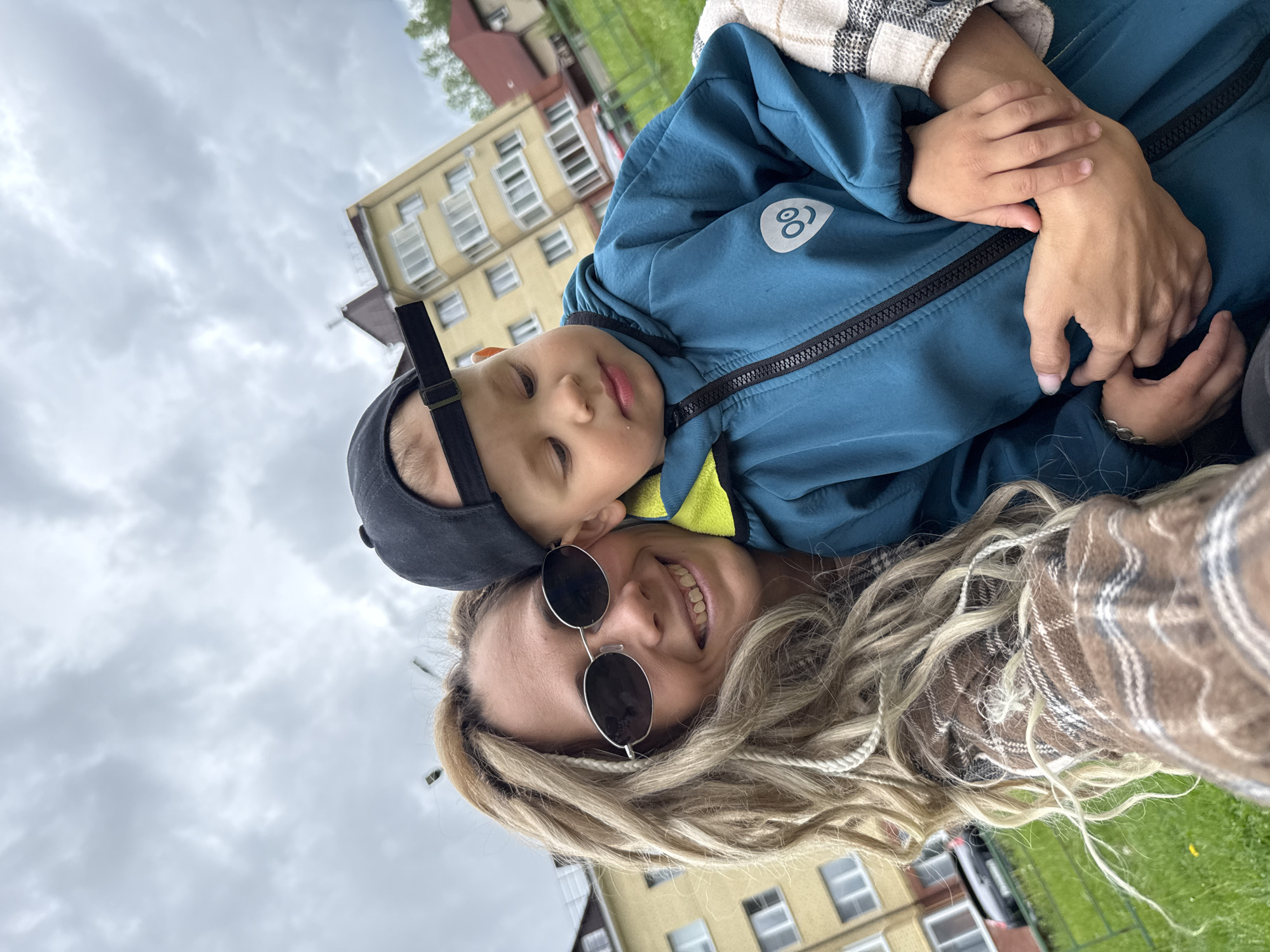 Mother and child enjoy morning playground visit in Rusanovo