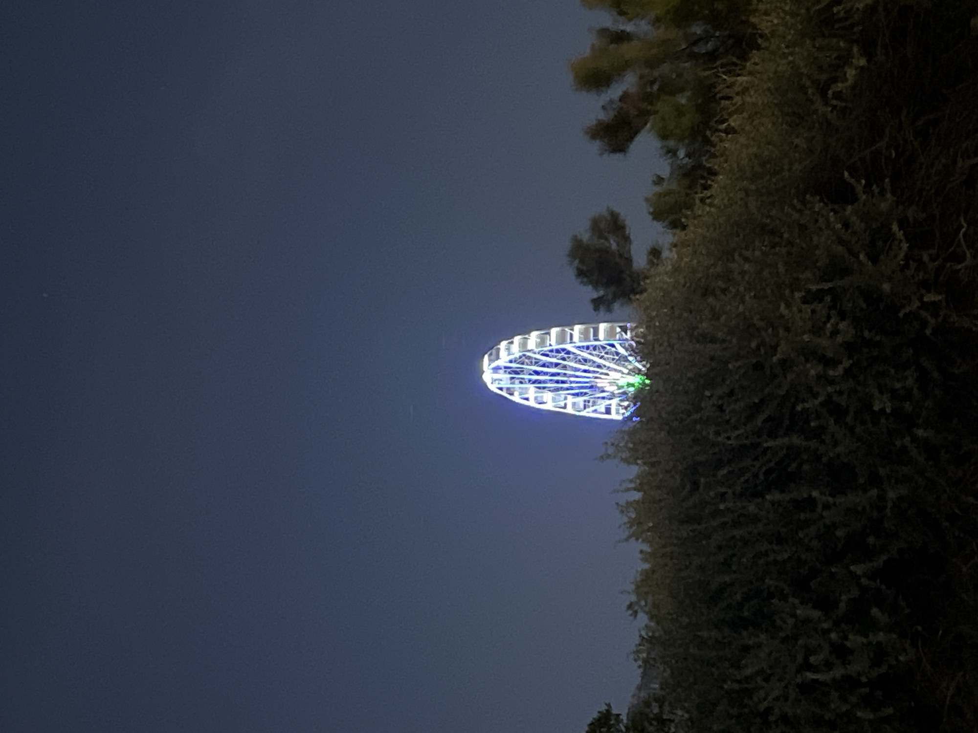 Lit Ferris wheel draws attention during Marseille twilight hours