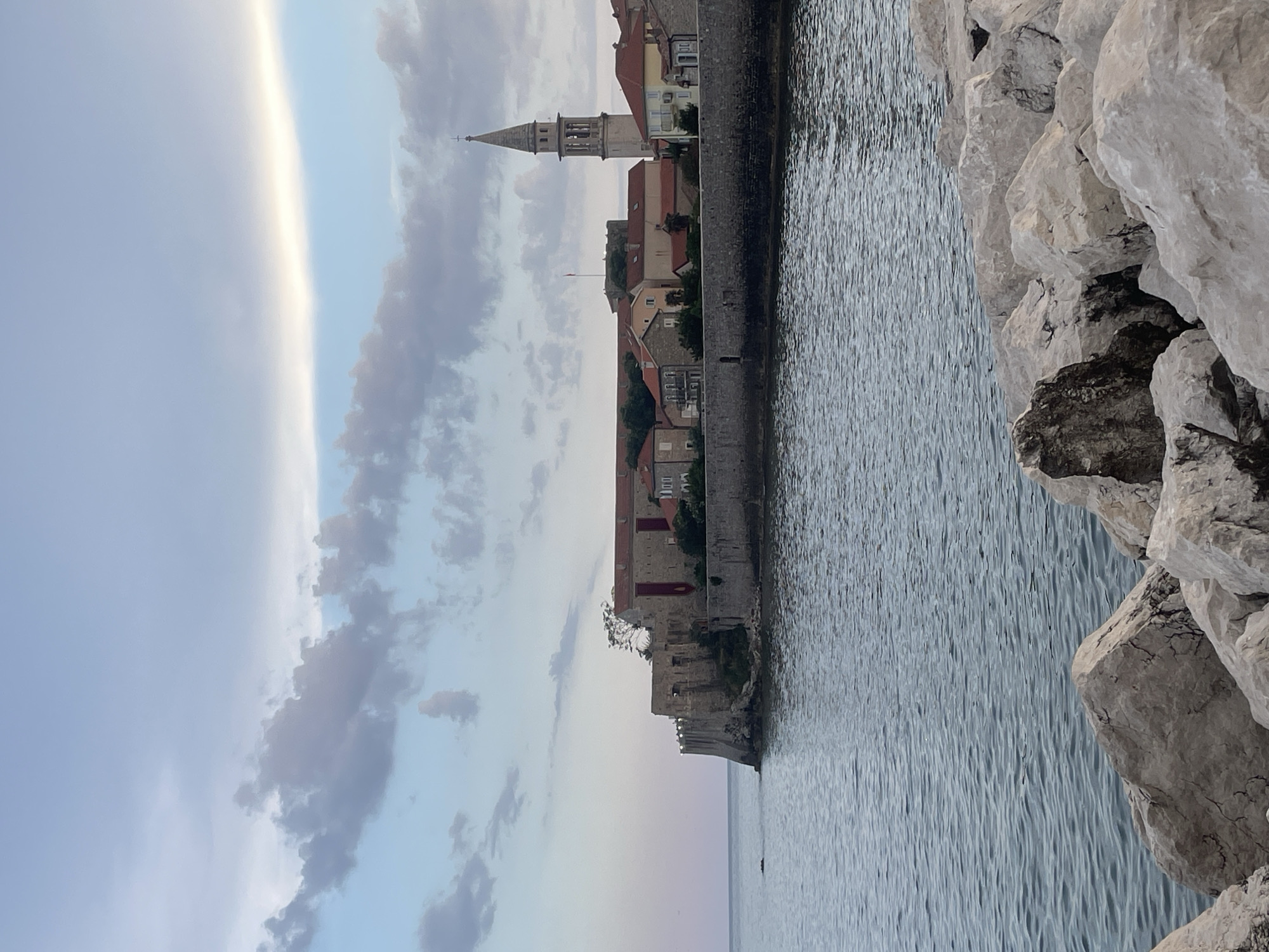 Evening stroll through Mediterranean coastal town captures harbor life