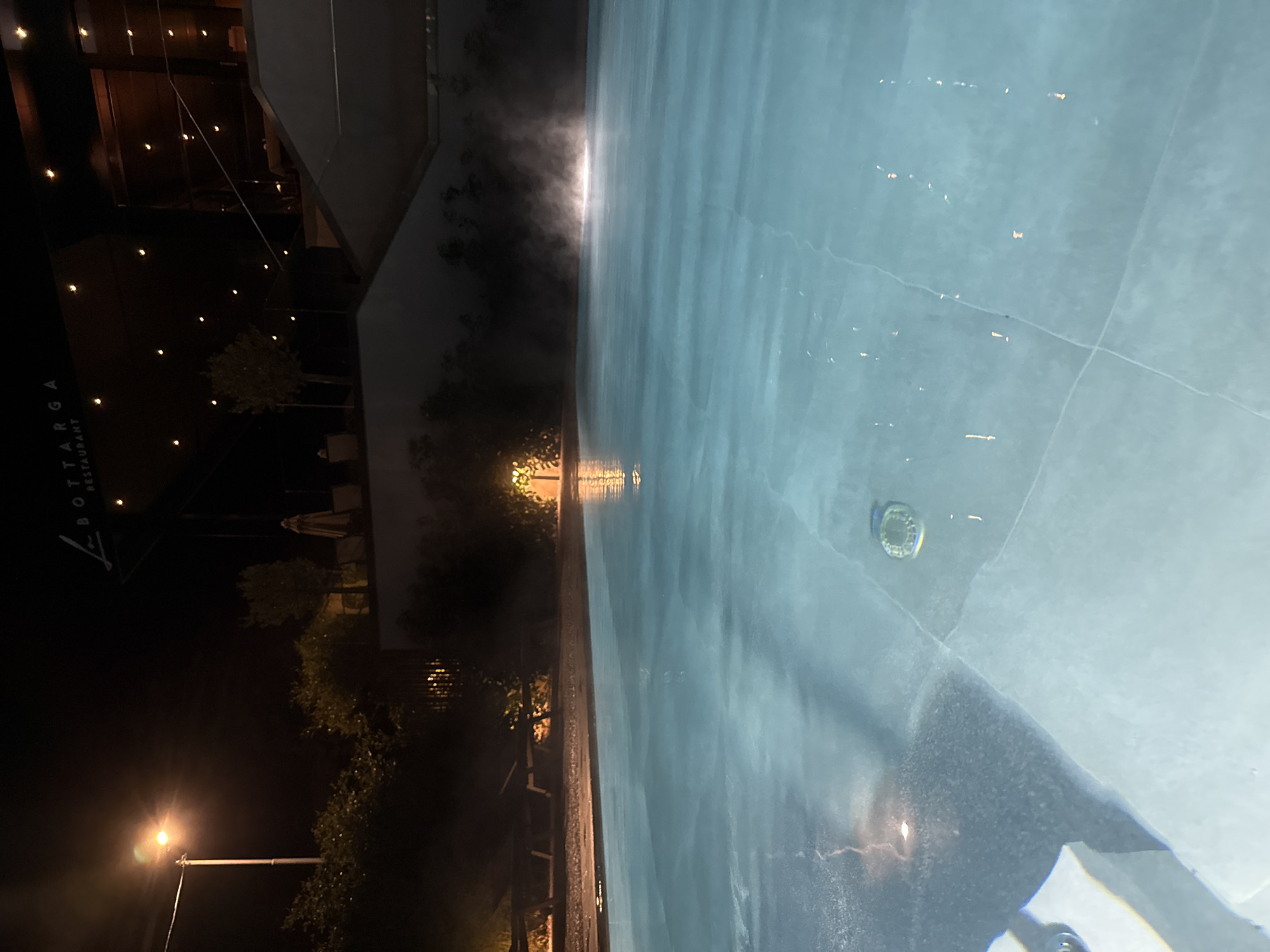 Steam rises from calm pool near Burgas restaurant