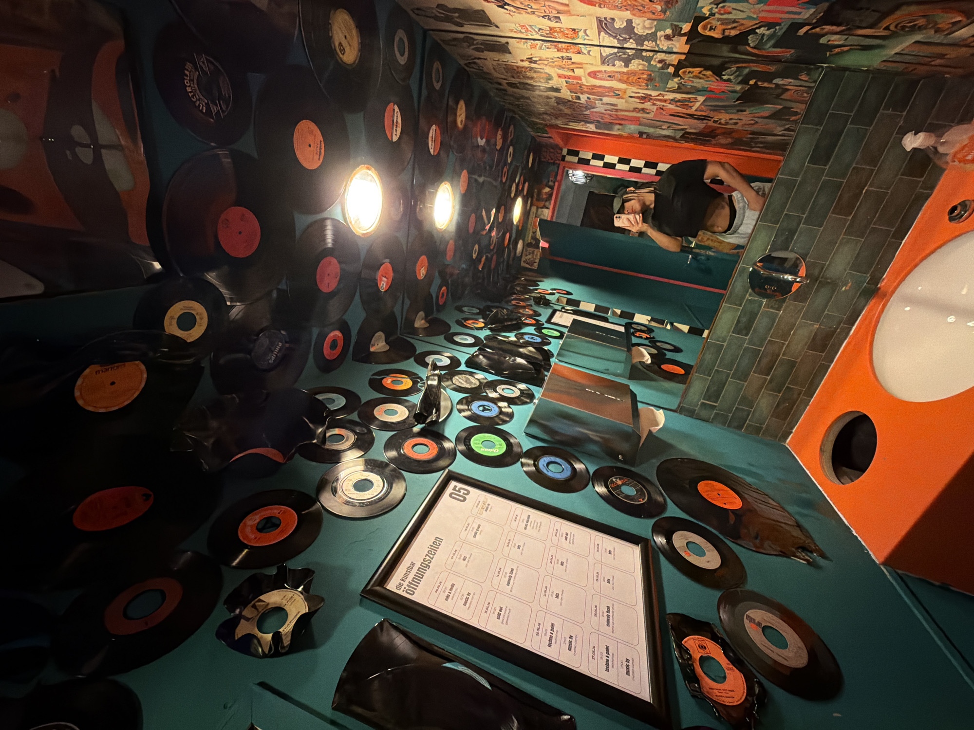 Patron captures vinyl-decorated bar interior in Cologne