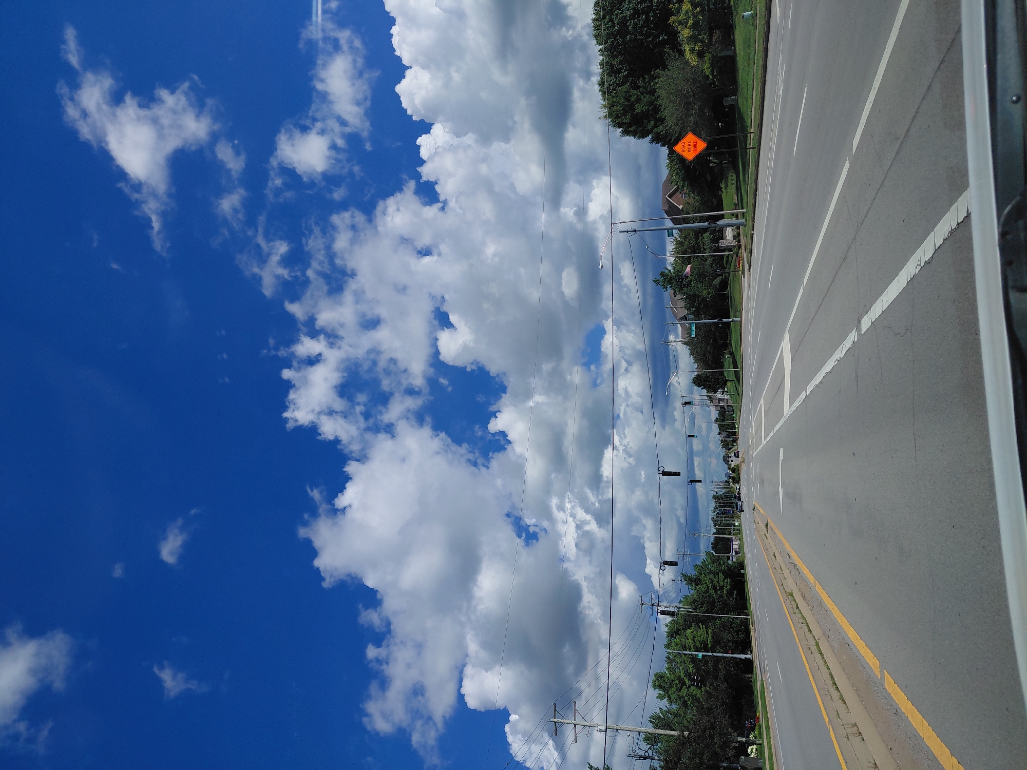 Clear summer drive through Lexington streets, blue skies above.