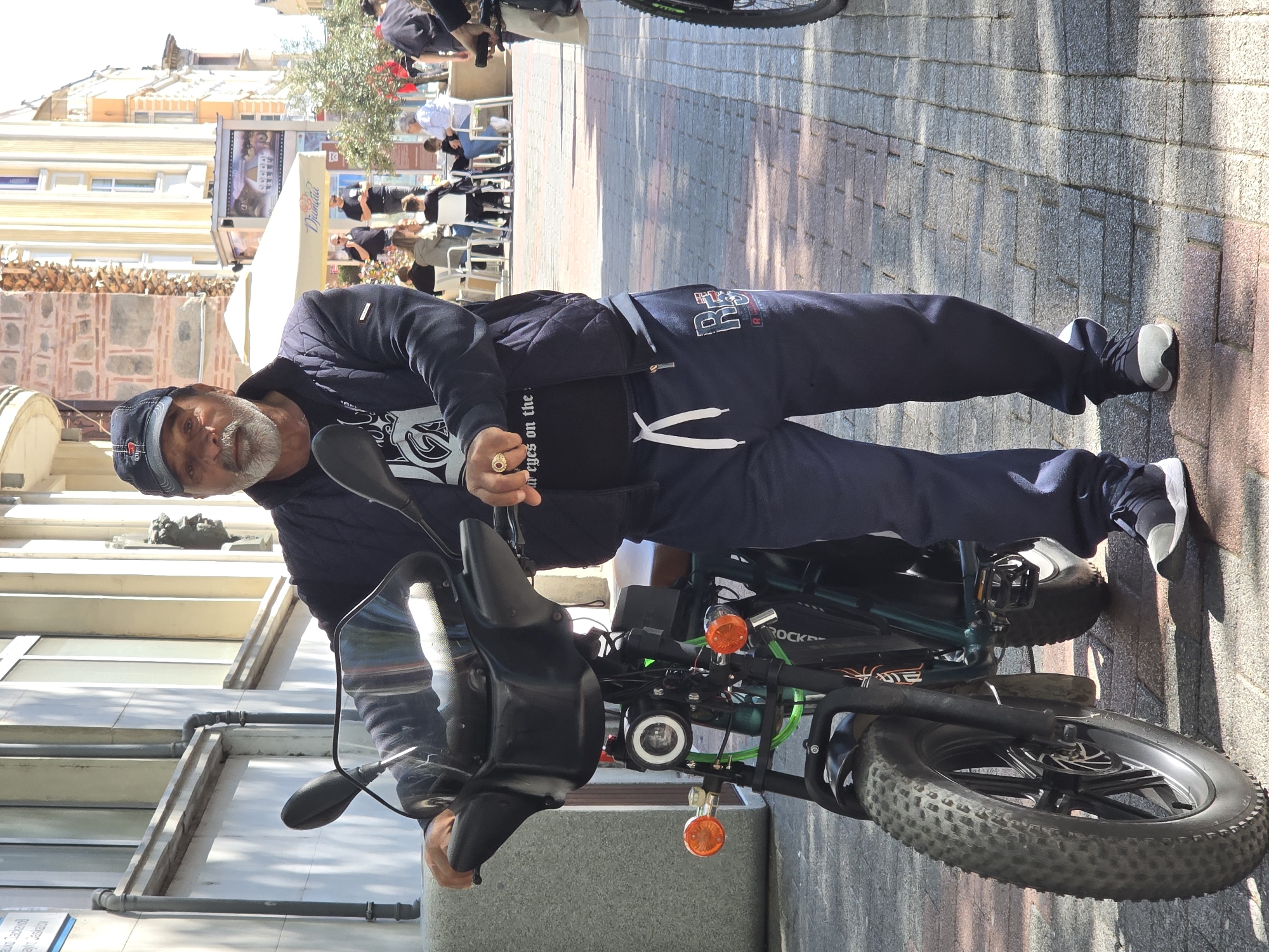 Cyclist observed on sunny street with bicycle