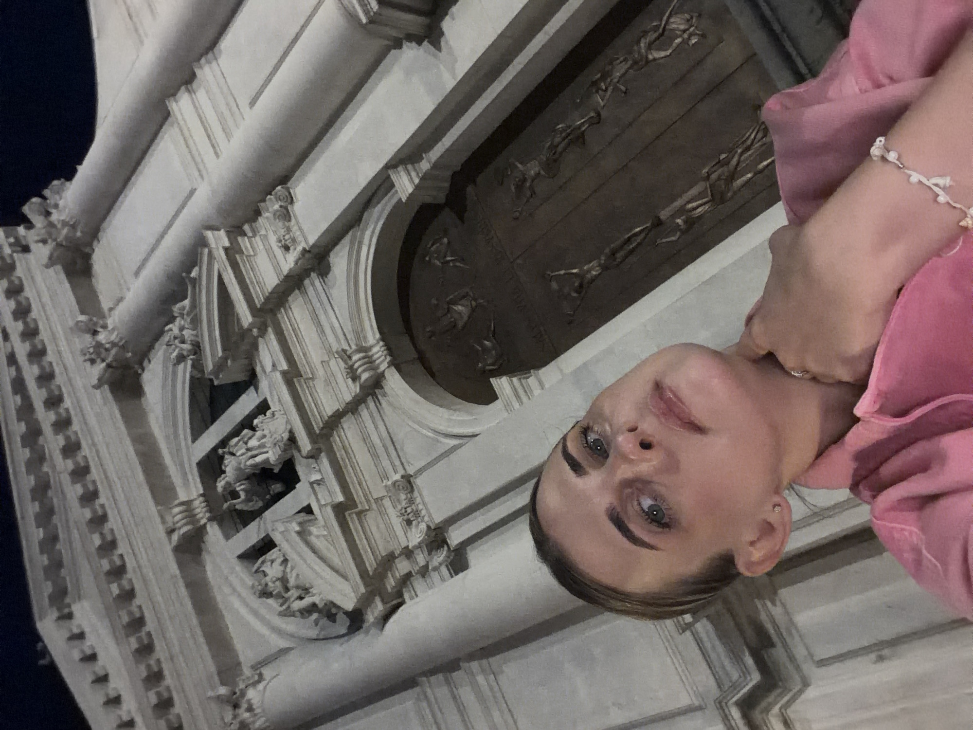 Nighttime selfies in front of an ornate stone building