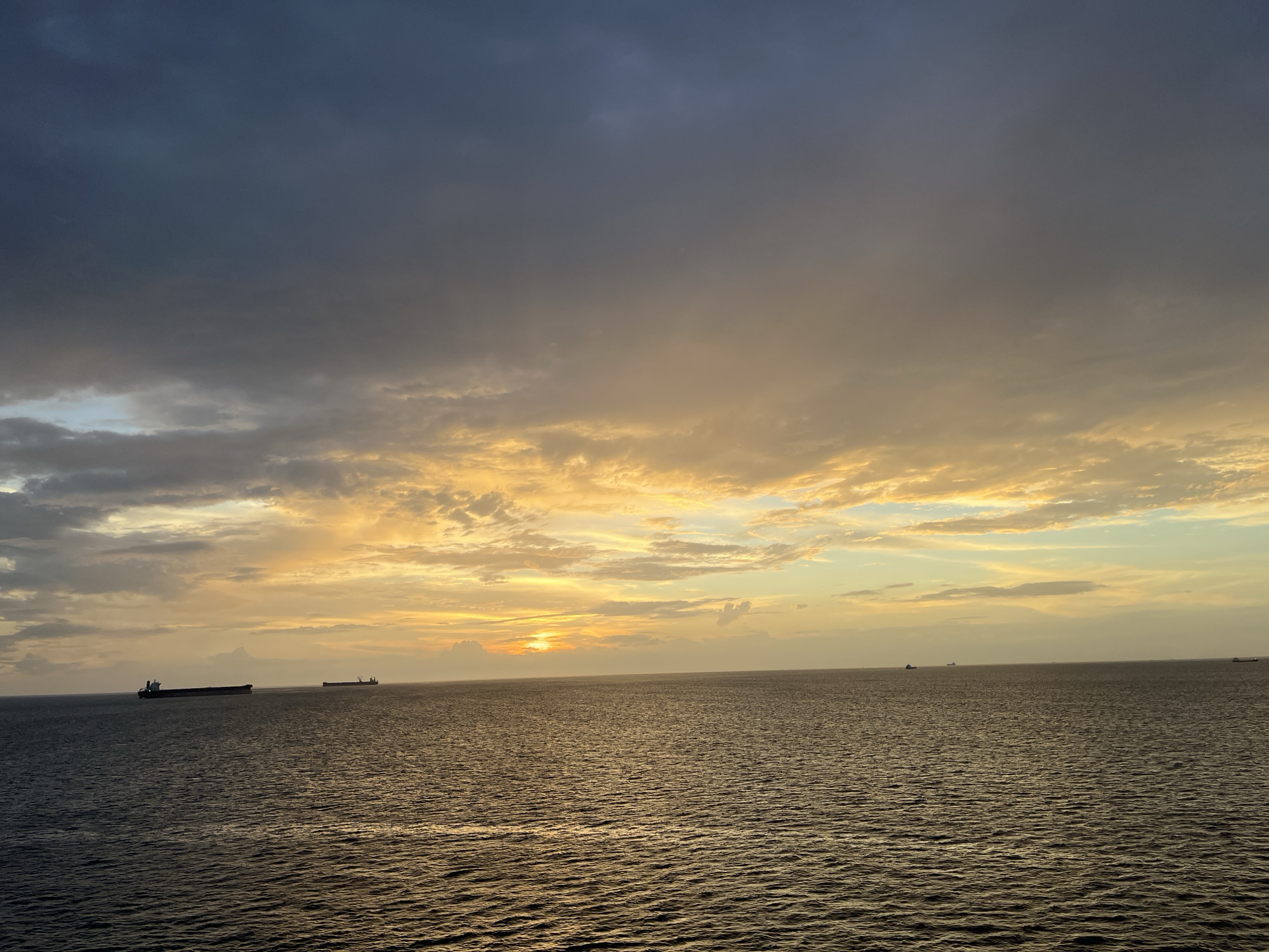 Ocean sunset captured by witnesses shows dramatic skies, golden light