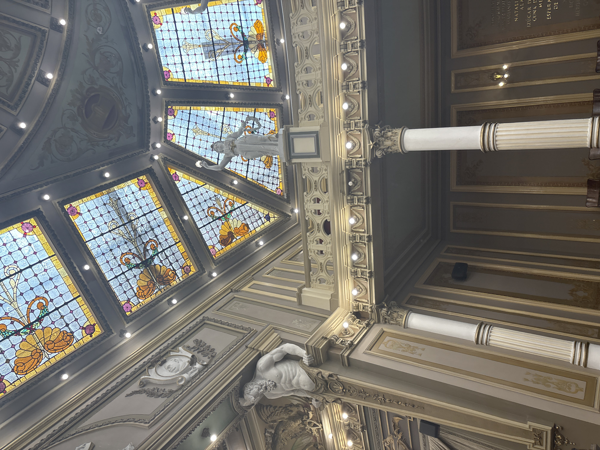 Ornate stained glass ceiling documented in Puebla building