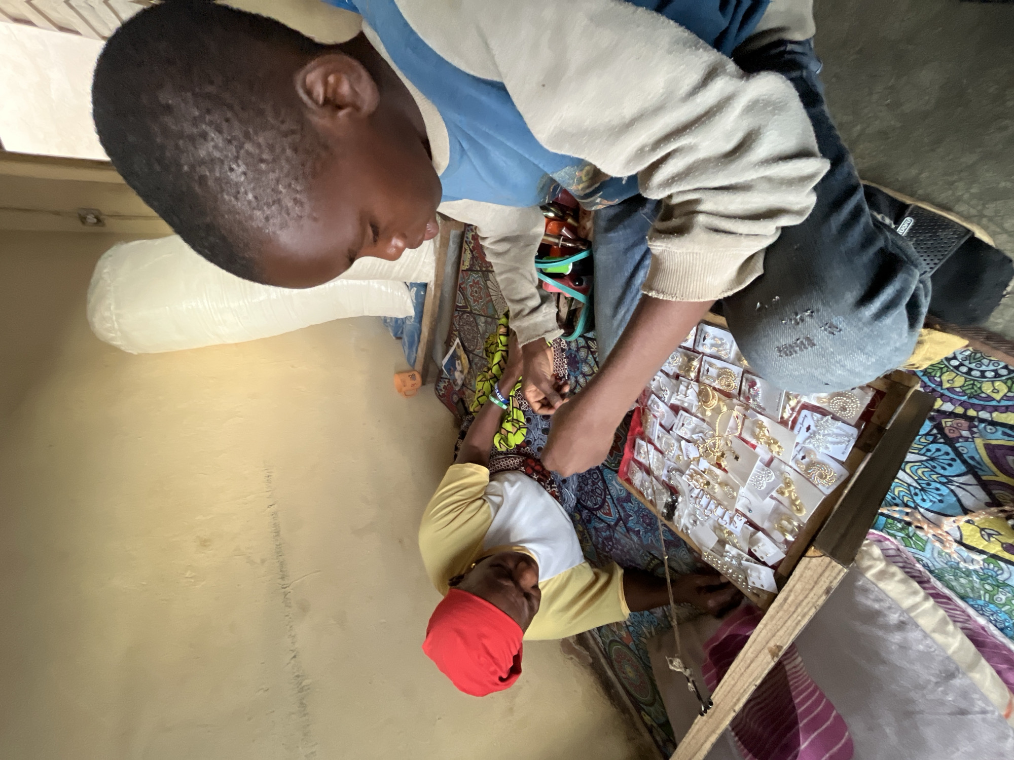 Street vendors conduct daily business in Jos, Nigeria markets