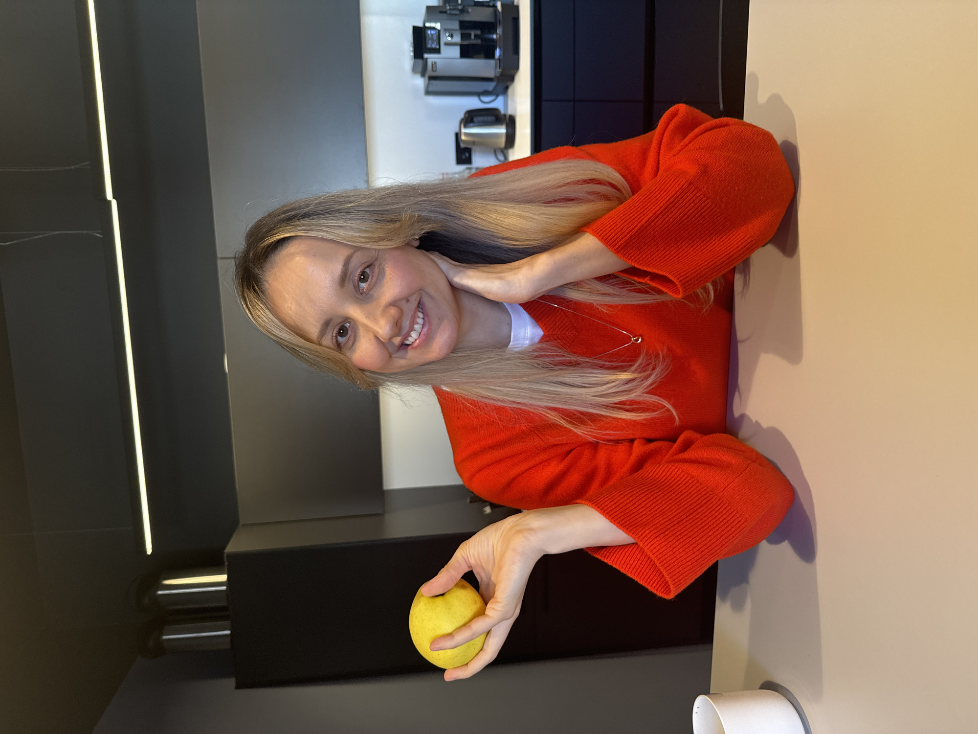 Woman with yellow apple spotted in Riga kitchen