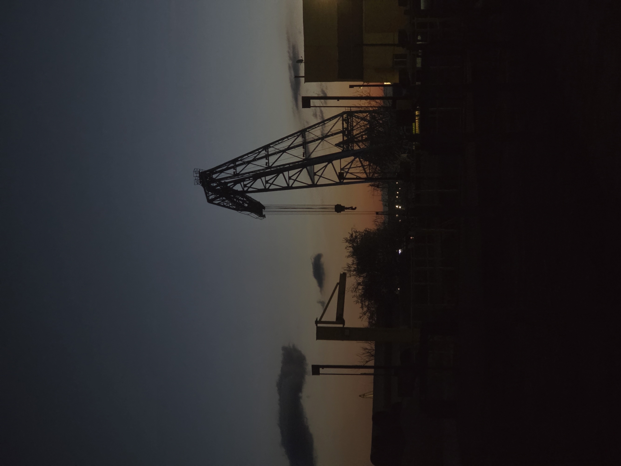 Gantry crane silhouetted against twilight sky in Ruse, Bulgaria