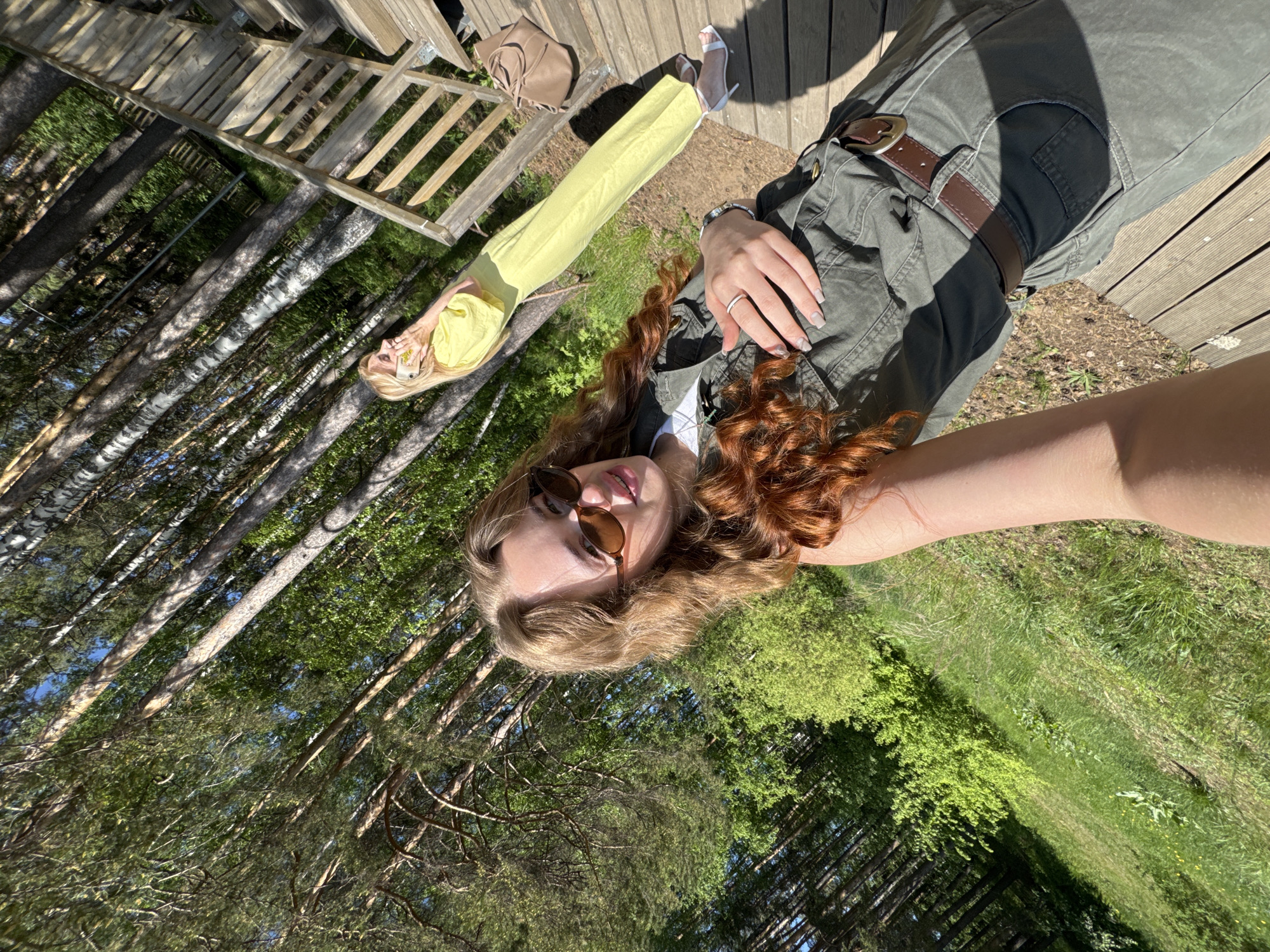 Women photograph themselves at playground in Chaikovsky, Russia