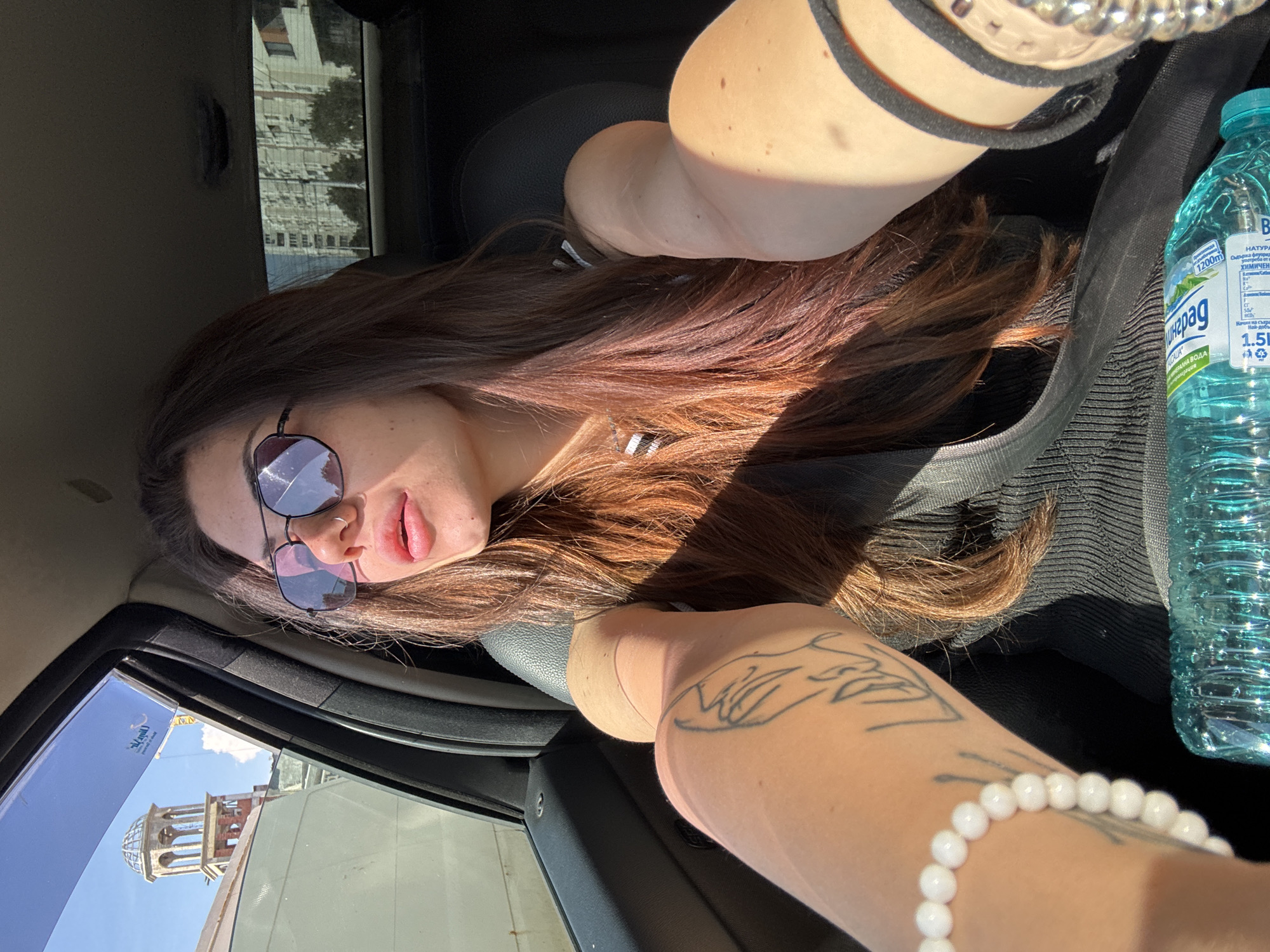 Woman takes car selfies during Sofia traffic
