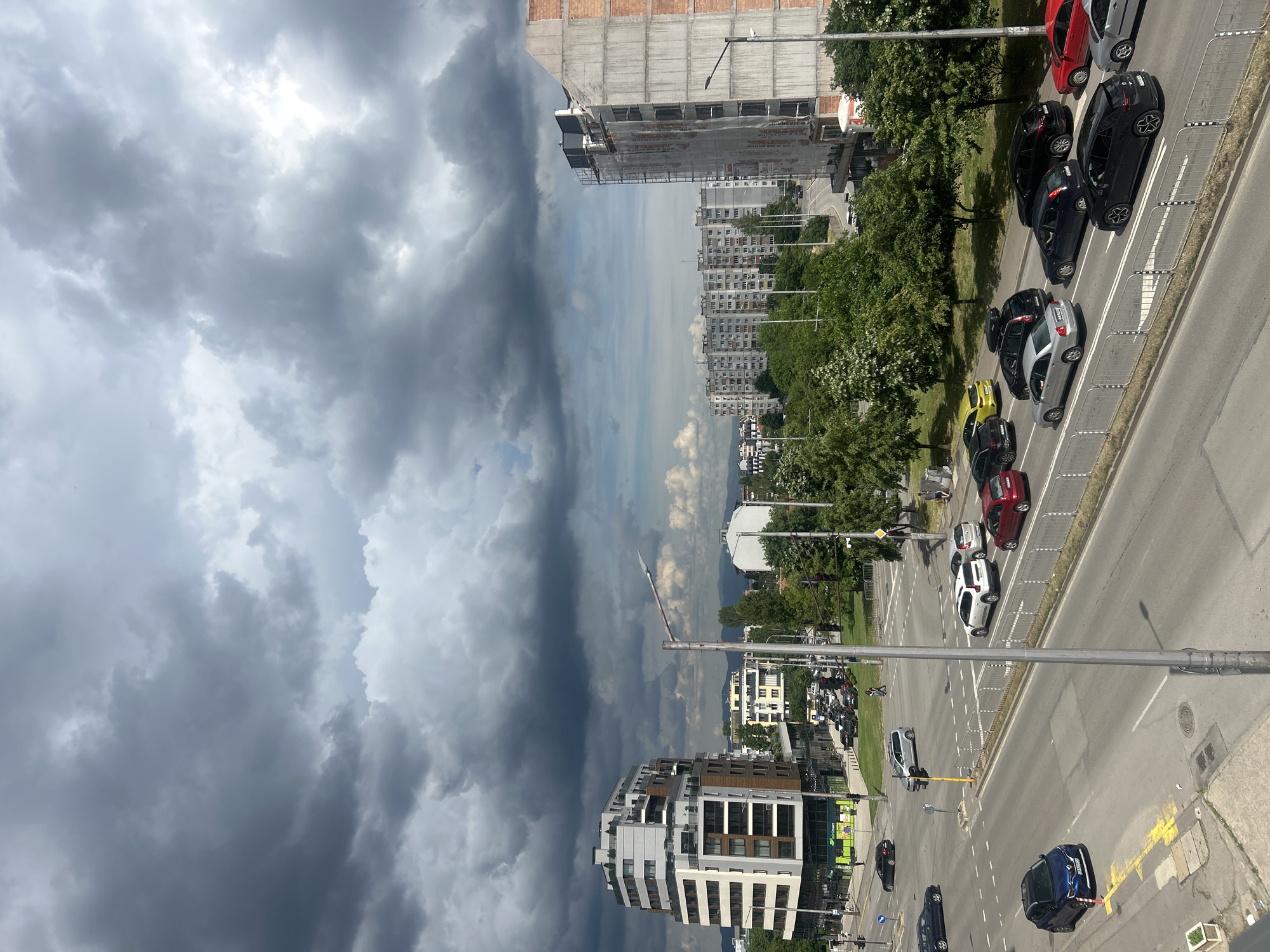 Dramatic clouds observed over busy Sofia street from elevated viewpoint
