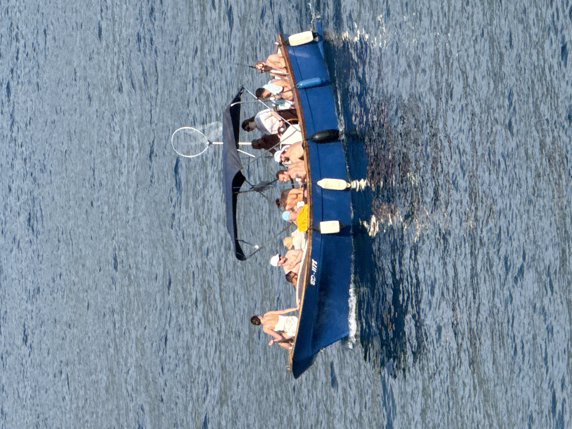 Boats and jet skis cruising the Budva coastline on a summer afternoon