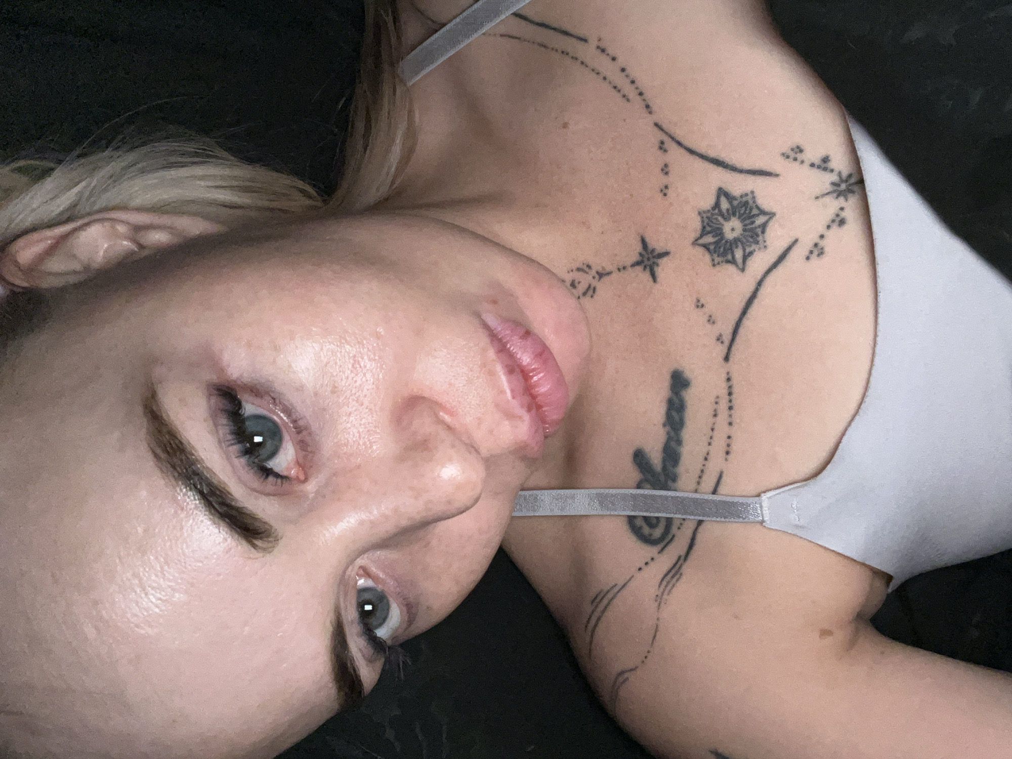 Indoor selfie series with pink headband and visible tattoos