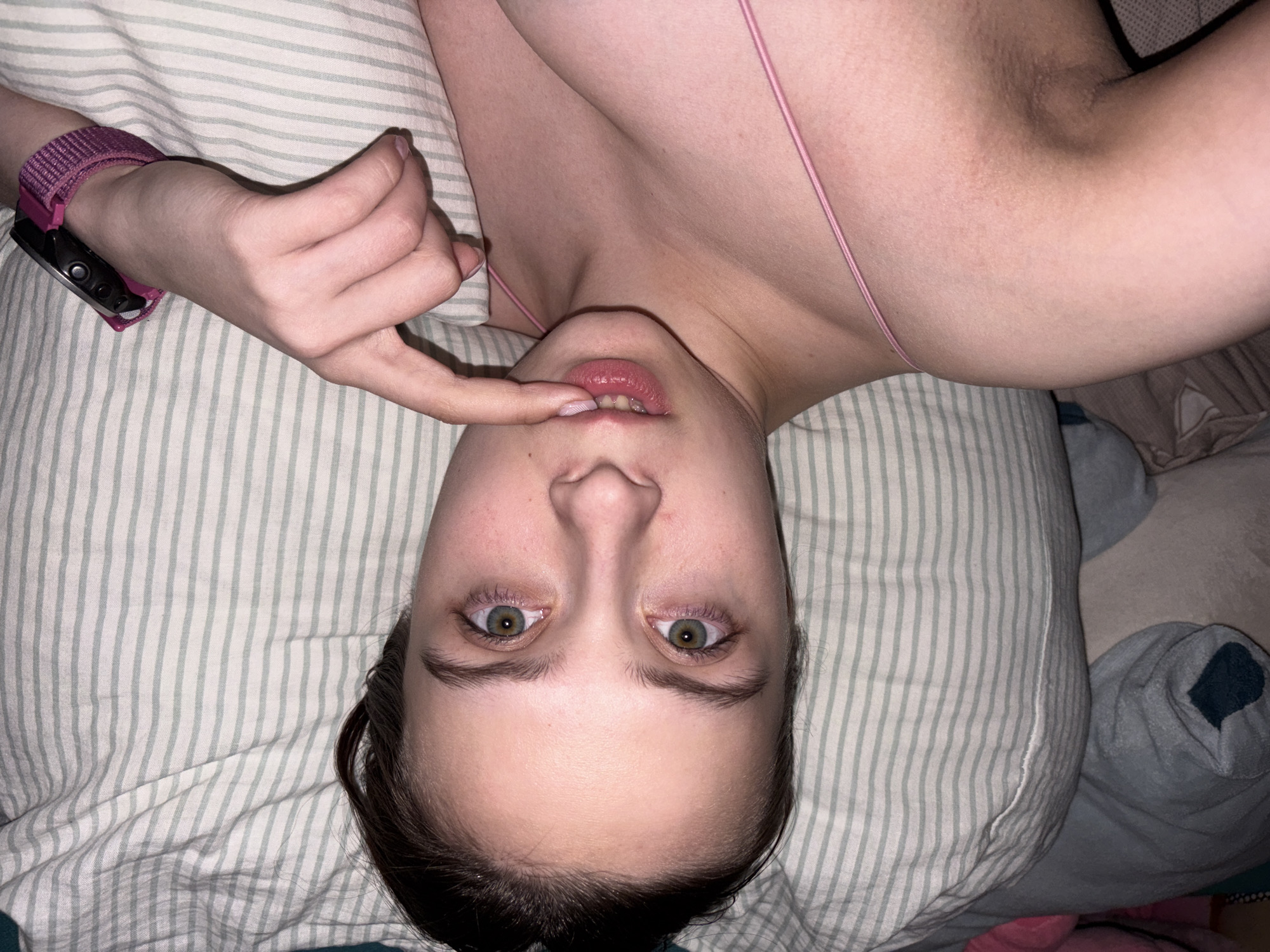Young woman photographs herself in bedroom, Прикамский Russia