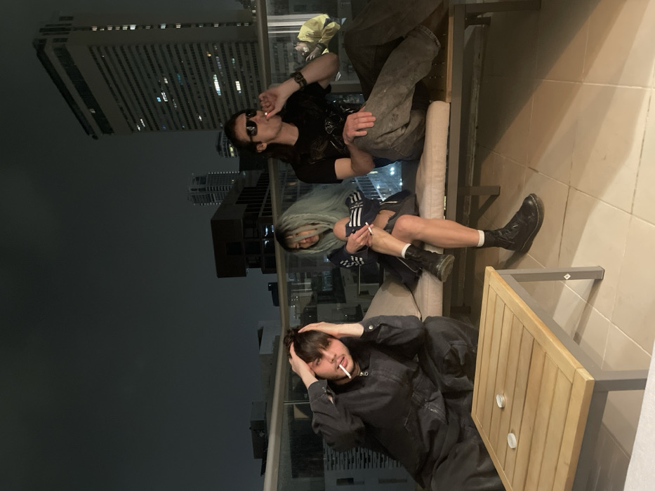 Young adults socialize on Tel-Aviv rooftop terrace Friday night