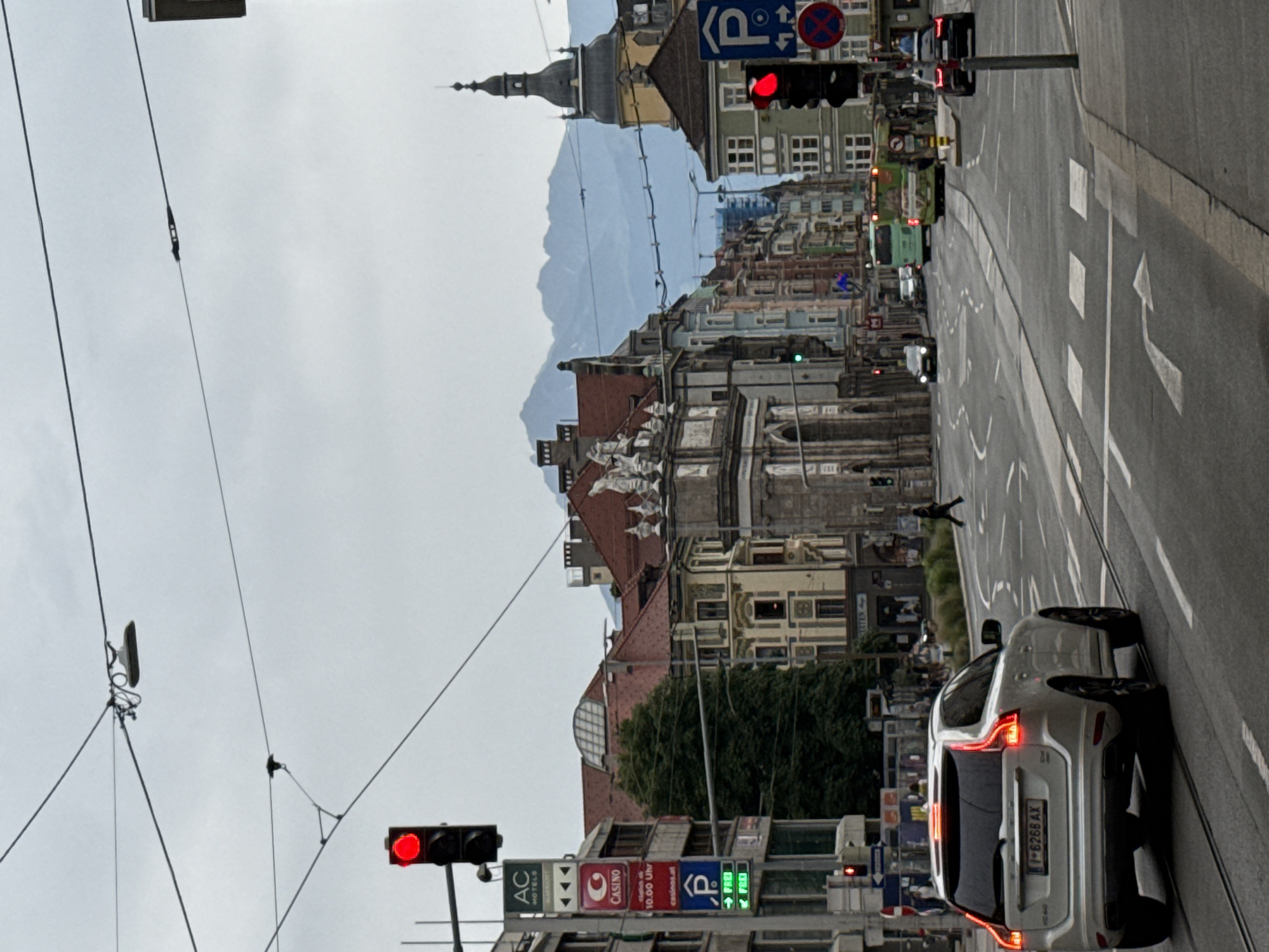 Strolling Innsbruck's city center streets with Alpine backdrop