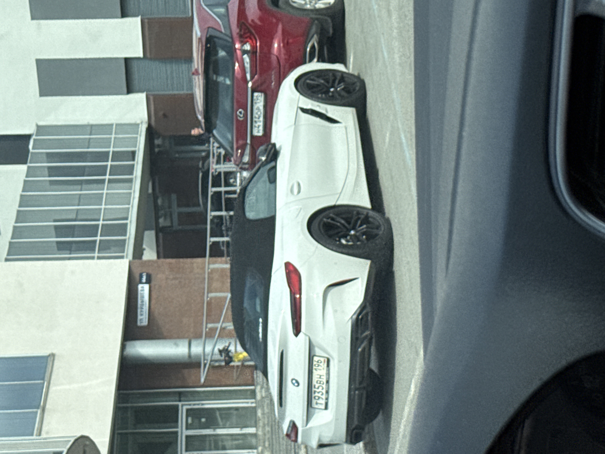 BMW Z4 and Lexus RX parked near Kuibyshev Street, Yekaterinburg