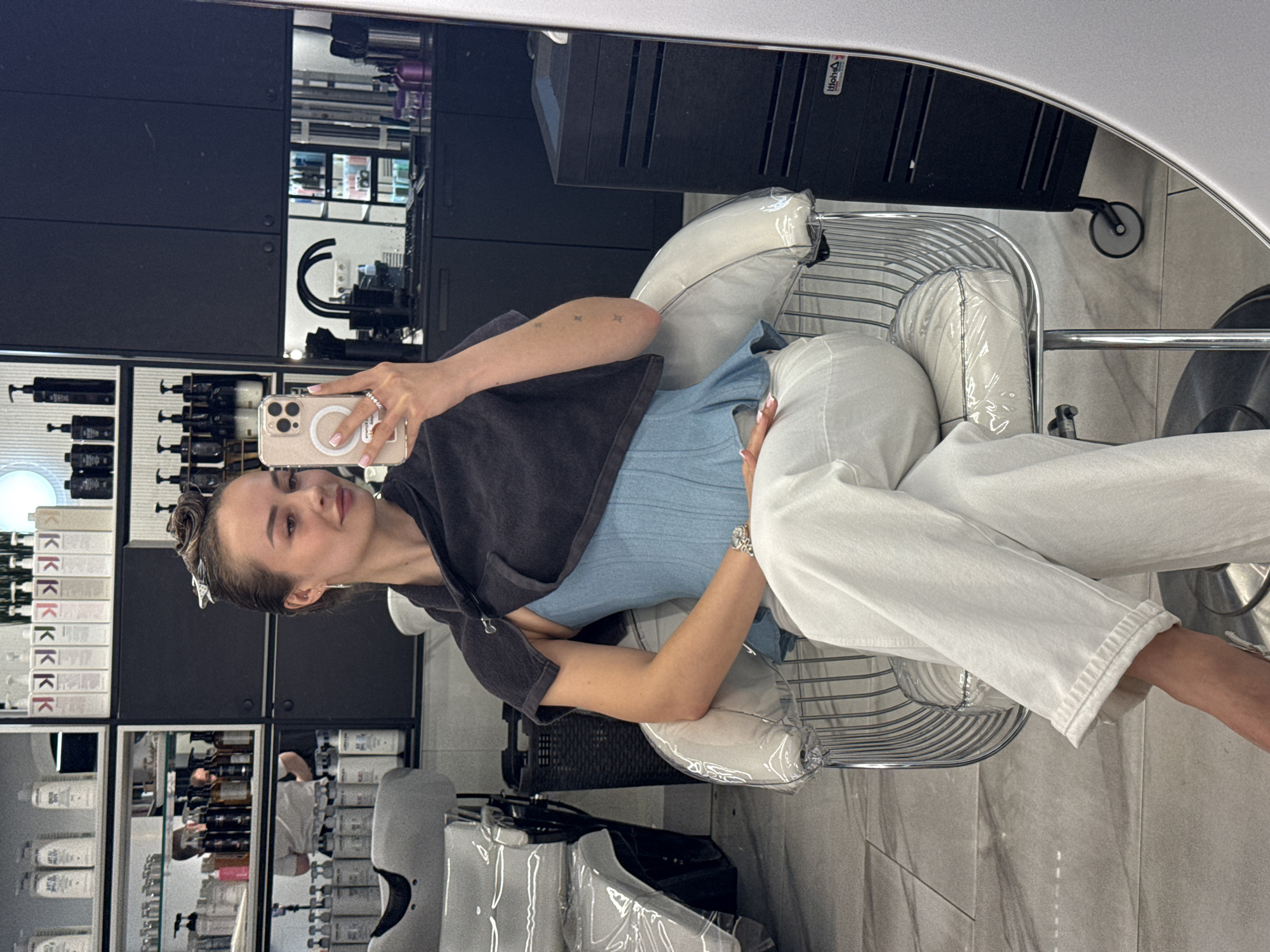 Woman takes salon selfie during hair appointment in Kyiv
