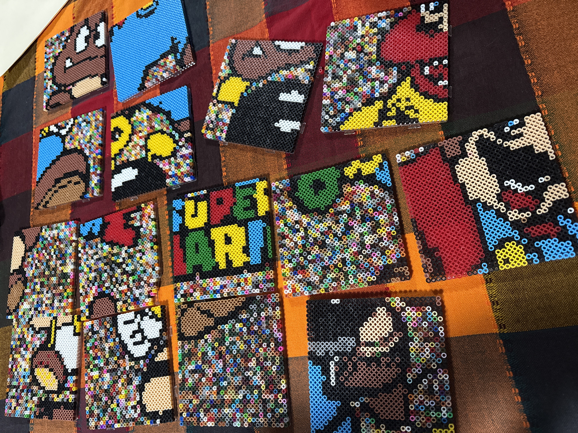 Handmade bead art featuring video game characters displayed in Puebla