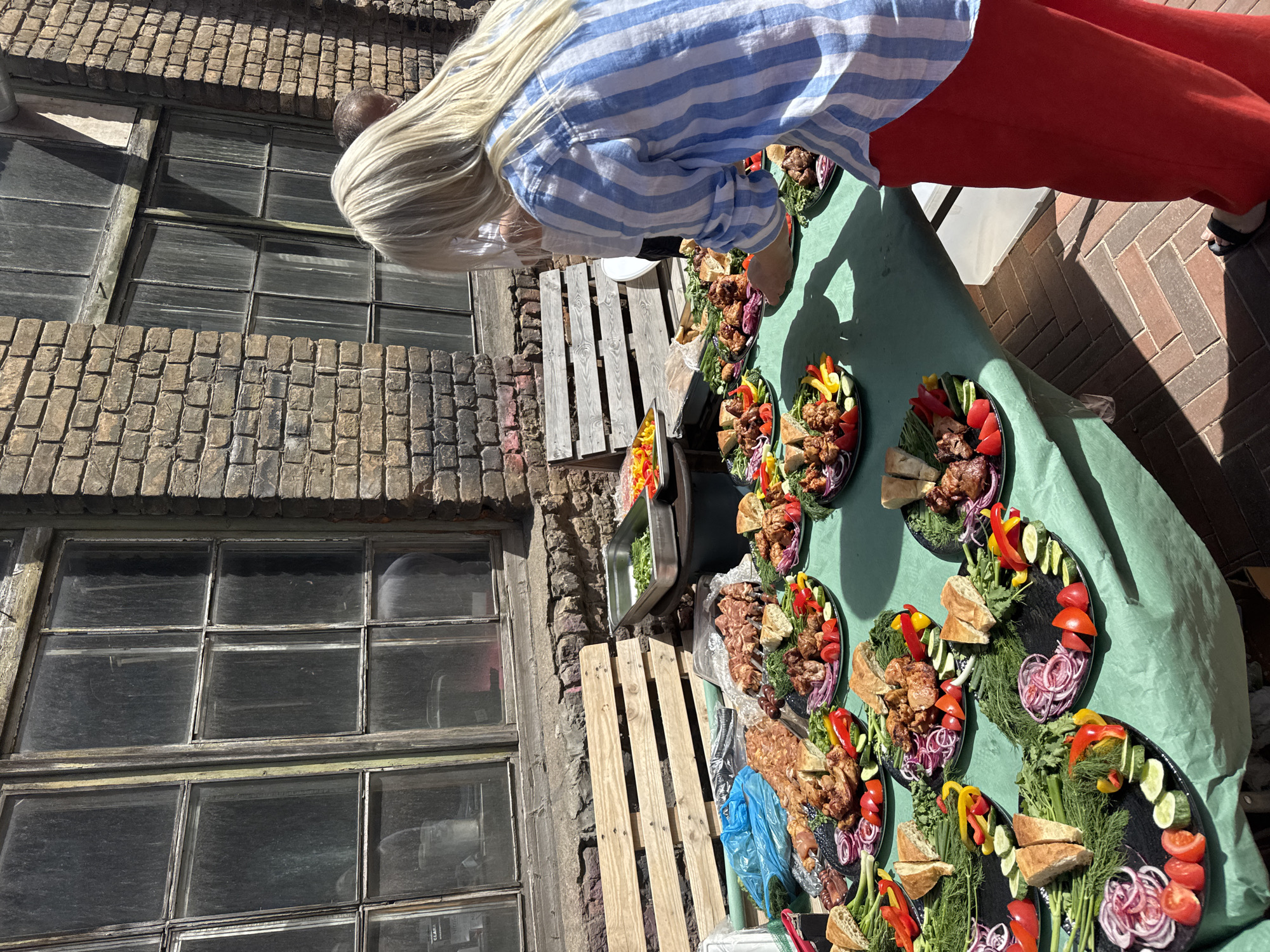Outdoor brunch event with live DJ set in Riga courtyard