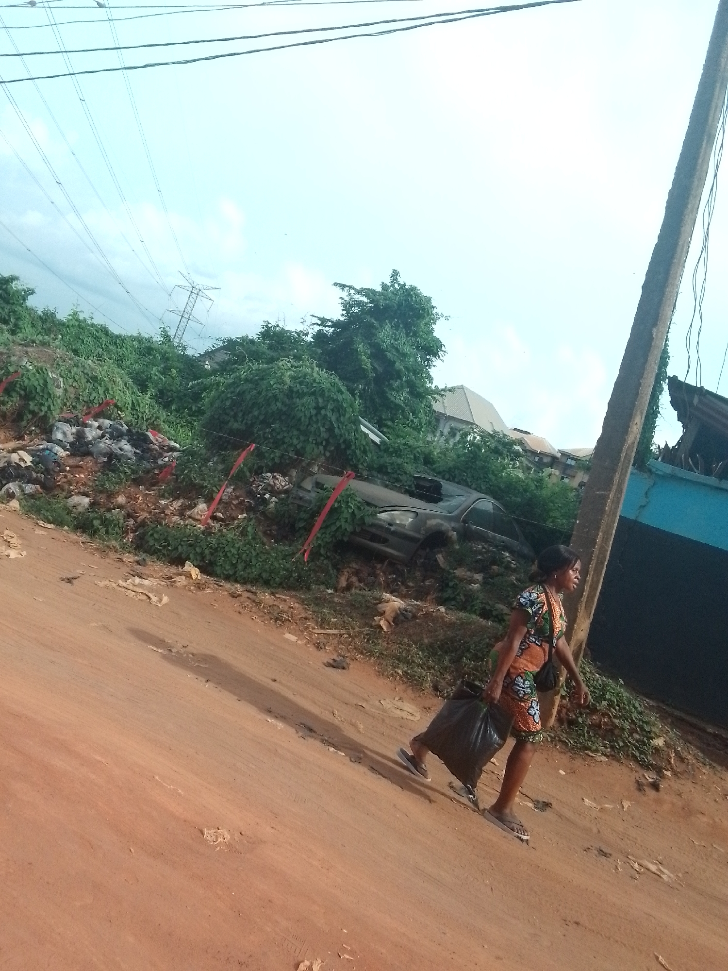 Daily life documented on unpaved streets in Onitsha, Nigeria