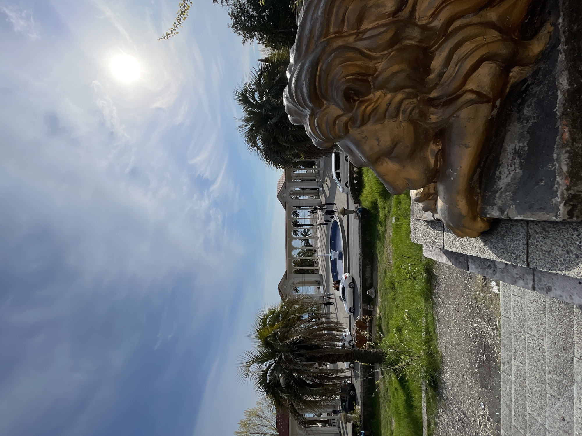 Golden lion statue and classical architecture documented in Abaata