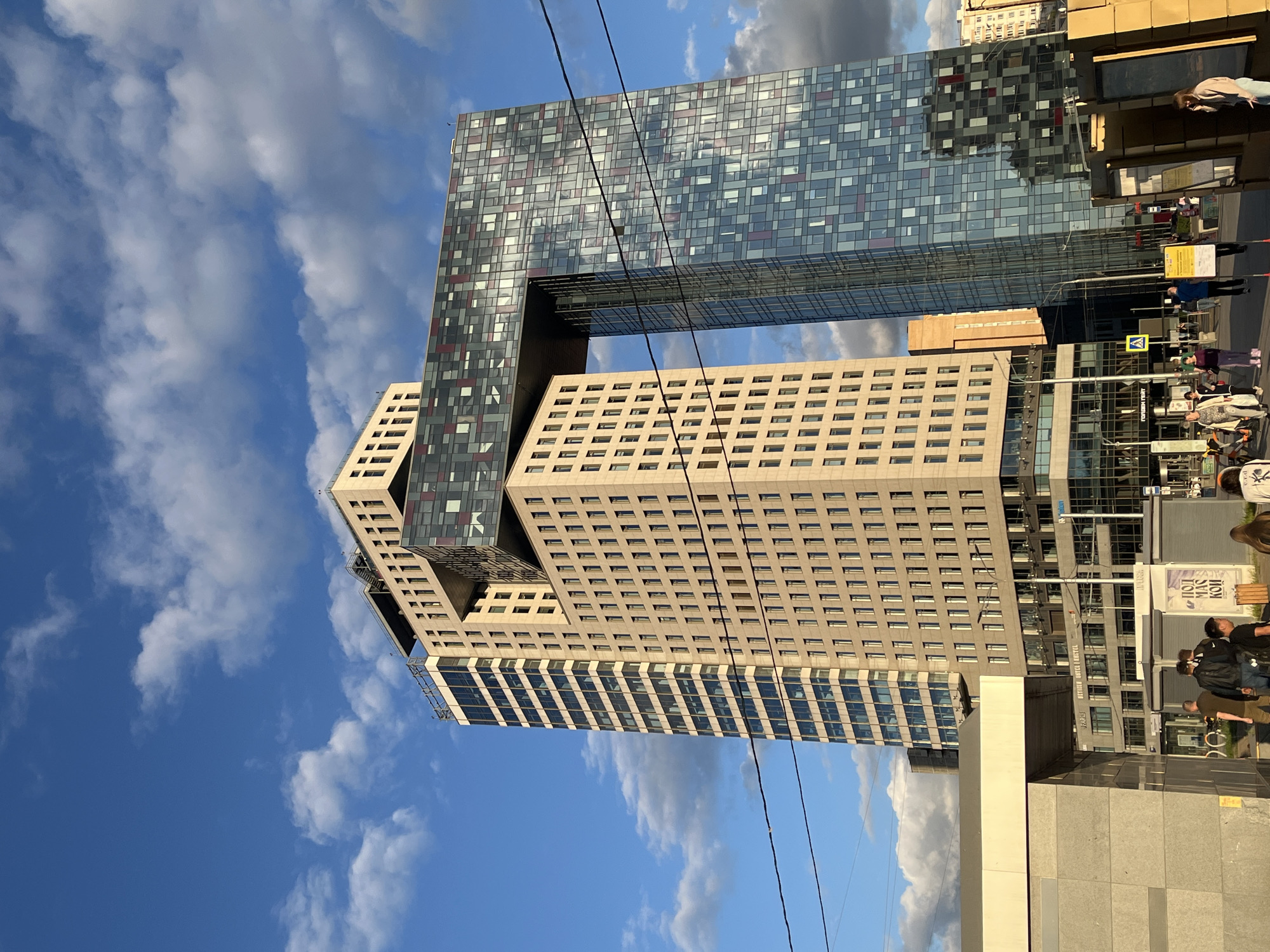 Urban life documented across city blocks during sunny afternoon